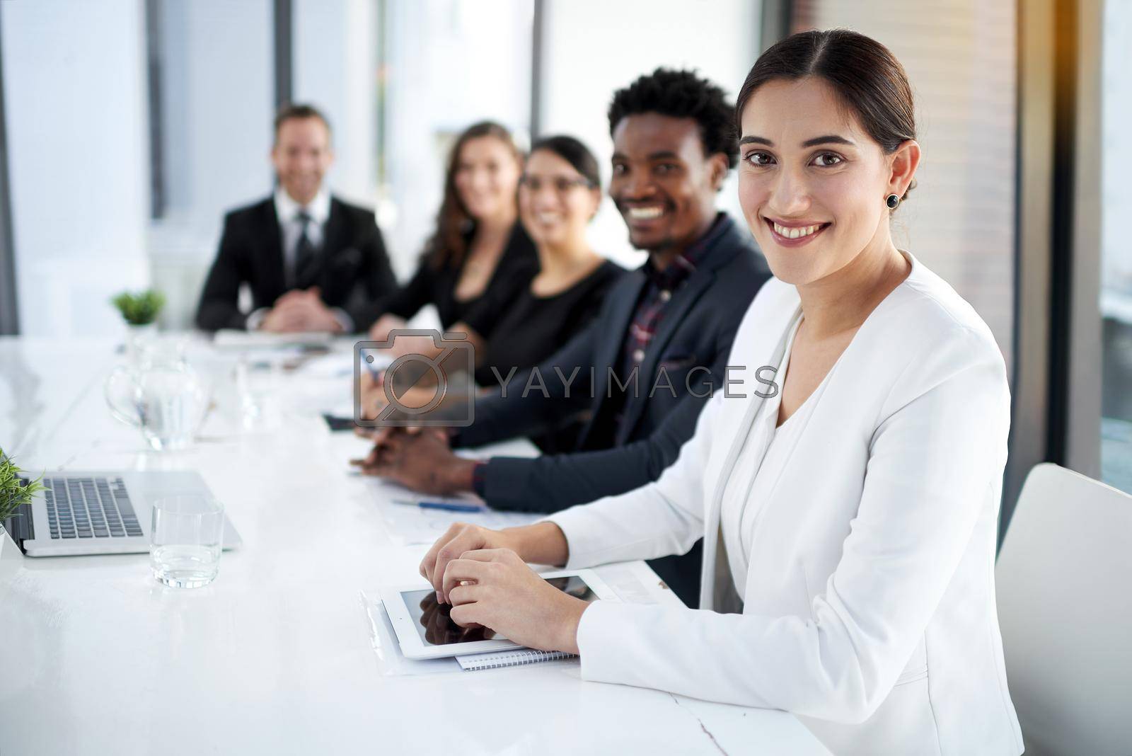 Royalty free image of Exceeding in business together. Portrait of a group of business colleagues meeting in the boardroom. by YuriArcurs
