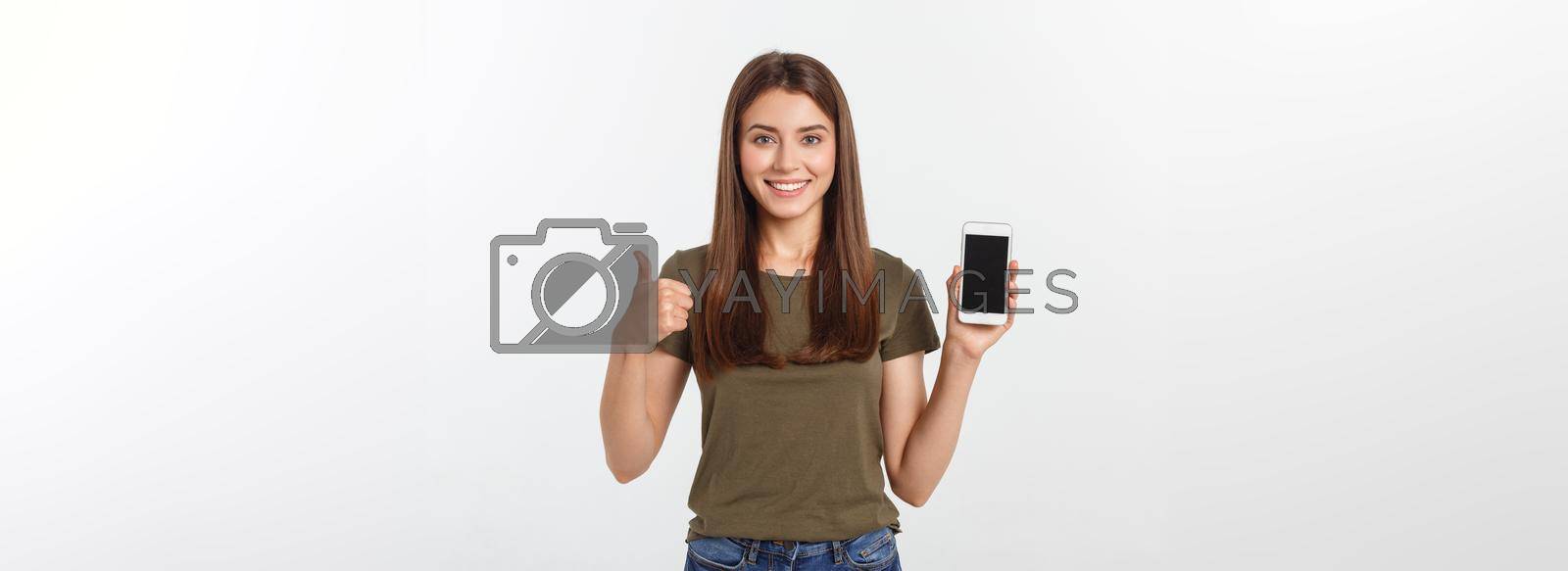 Royalty free image of Girl Holding Smart Phone - Beautiful smiling girl holding a smart phone by Benzoix