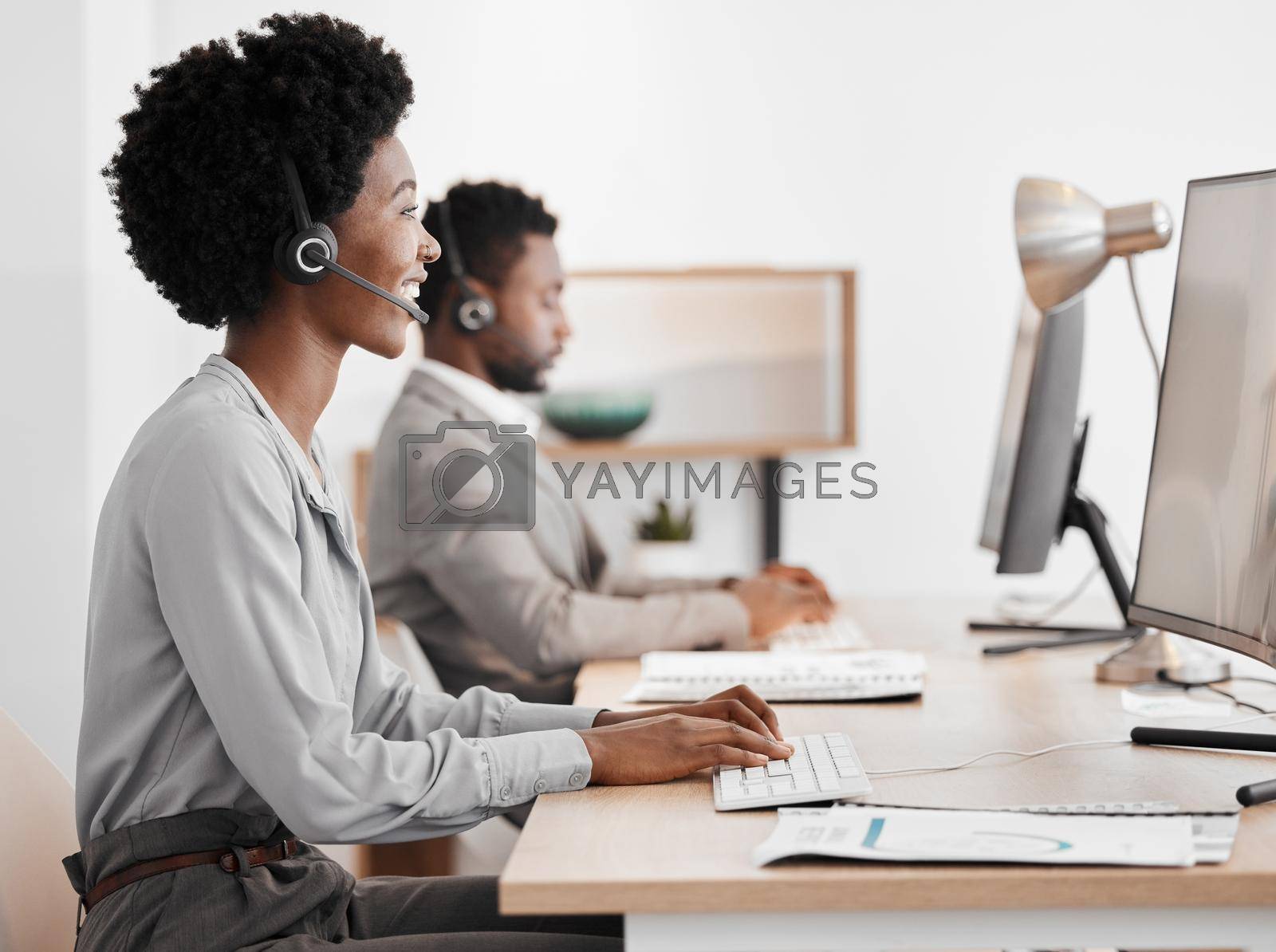 Call center worker talking on online communication with computer in office, giving advice at telemarketing company and consulting on internet. Happy customer service consultant giving support.
