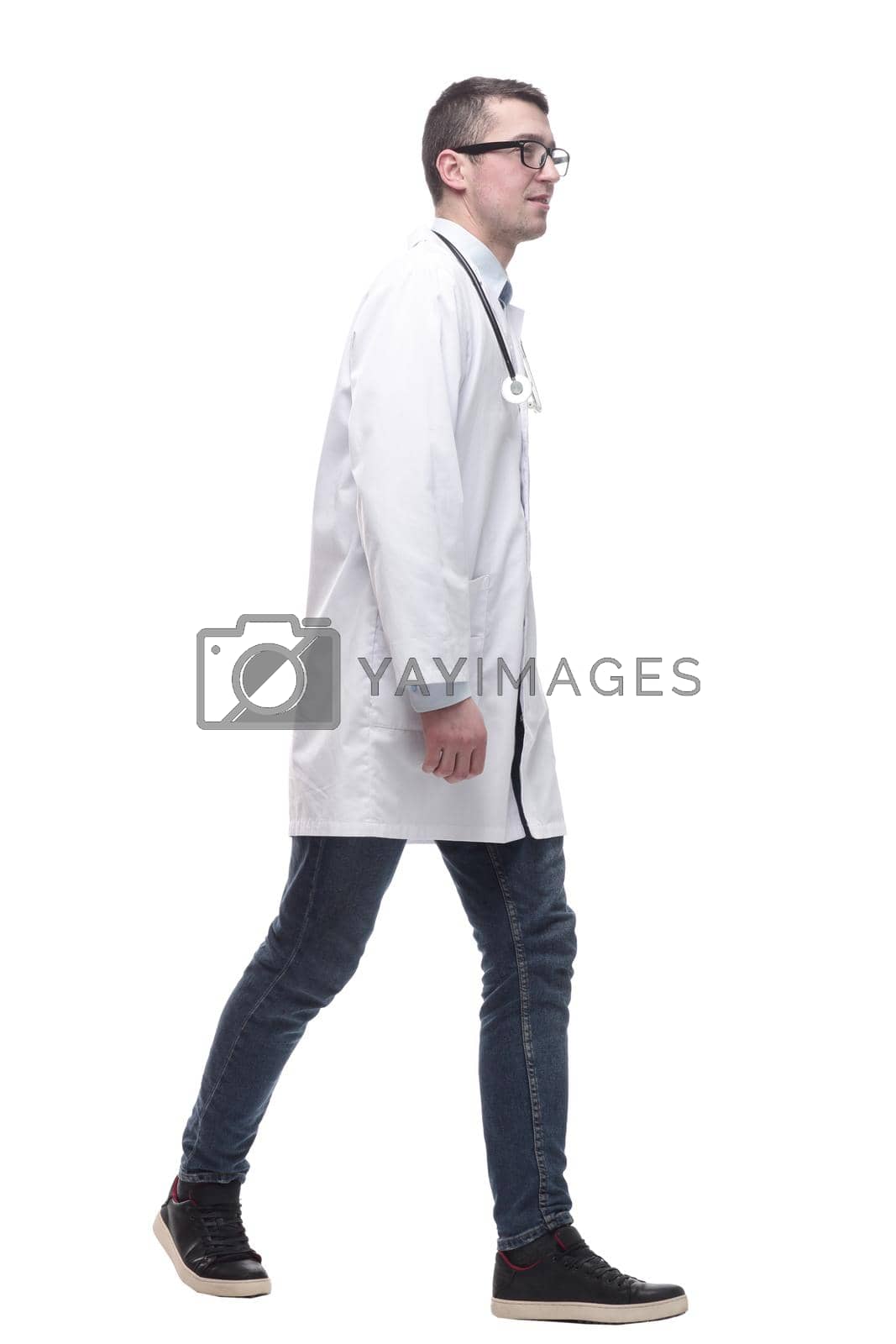 Royalty free image of doctor in a white coat striding forward. by asdf