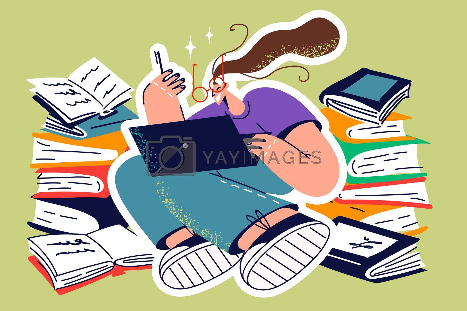 Royalty free image of Female student study on laptop with books by Vasilyeu