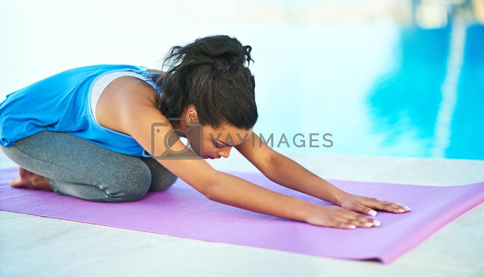Stretching away the stress. a young woman doing yoga outdoors