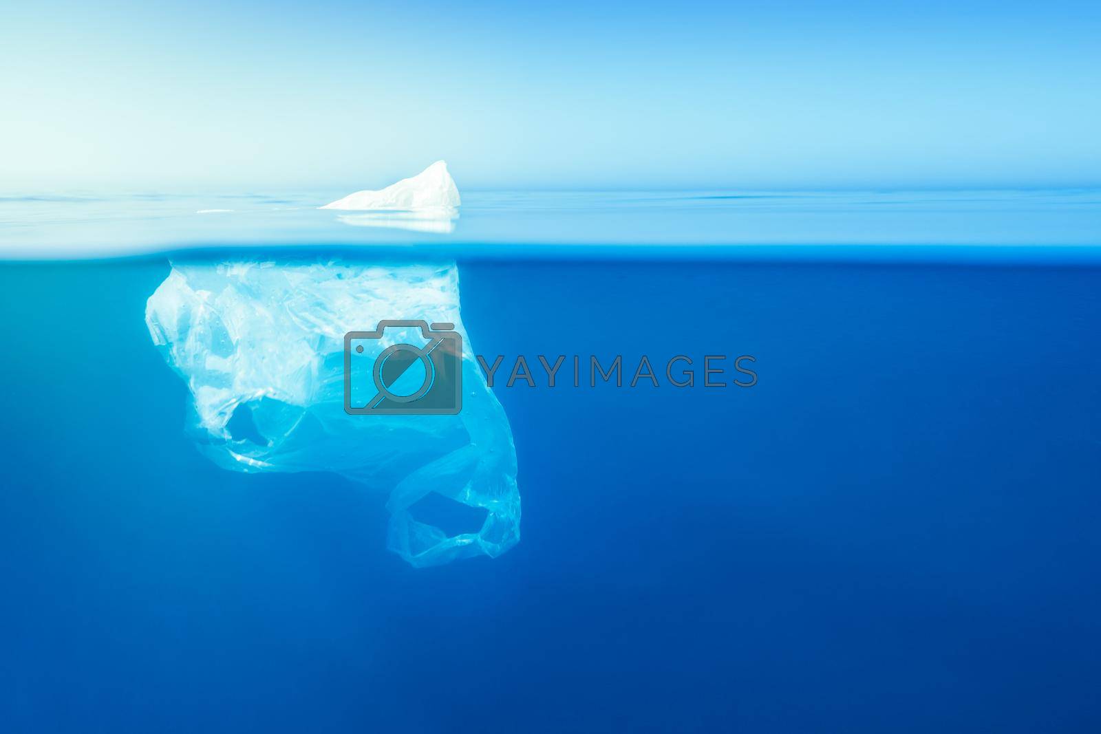 Royalty free image of plastic bag floating at water, iceberg metaphor by raulmelldo