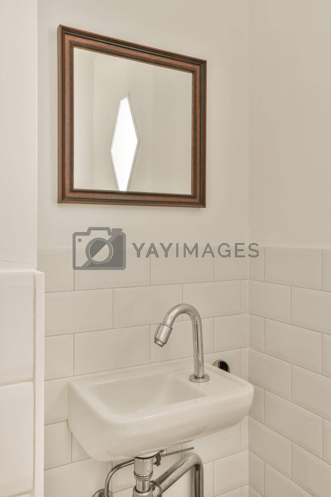 Royalty free image of Simple toilet with small sink by casamedia