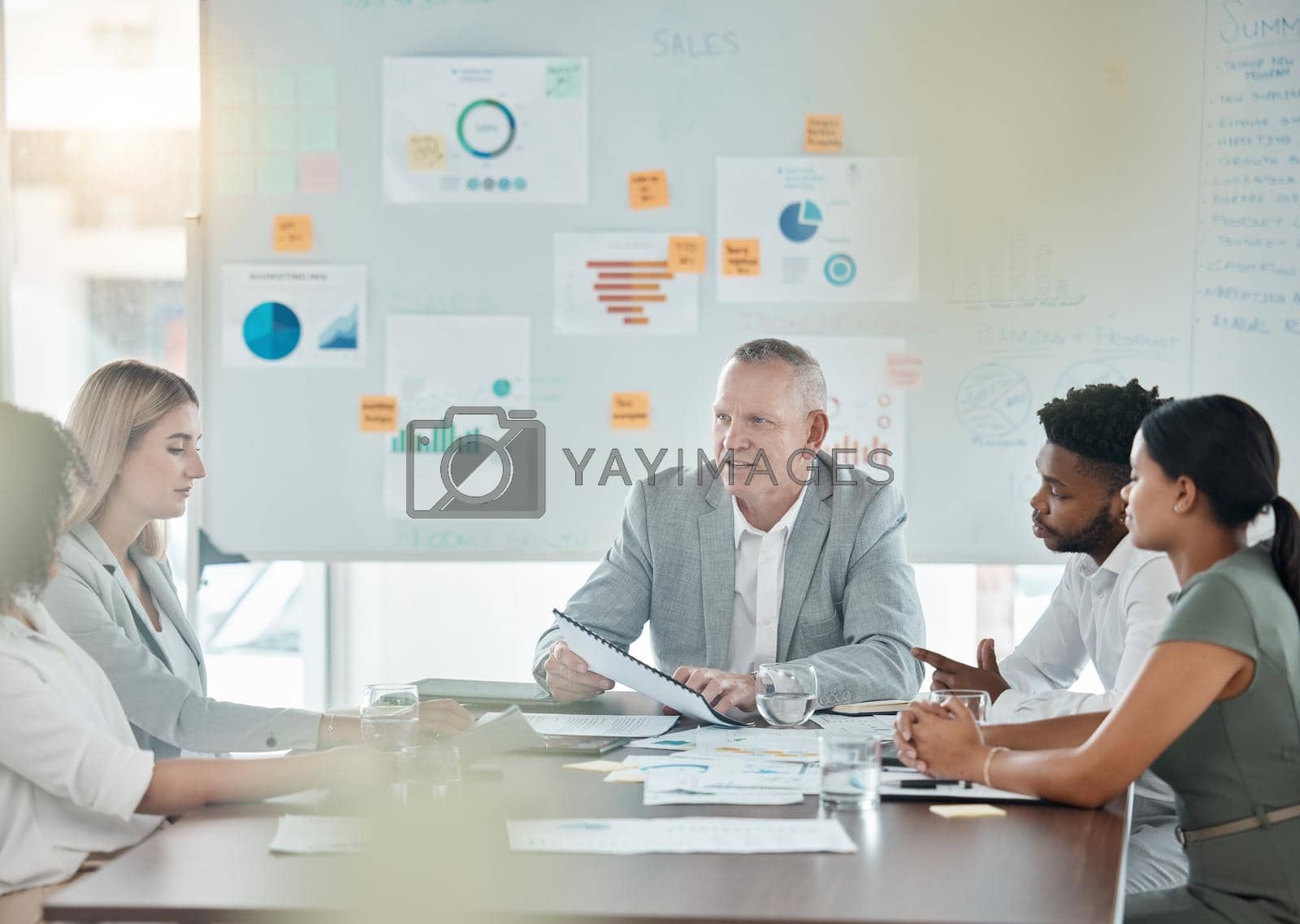 Royalty free image of Meeting, training and collaboration with a manager, leader or CEO and his team in a workshop or presentation. Teamwork, learning and coaching in the boardroom for company growth or future development by YuriArcurs