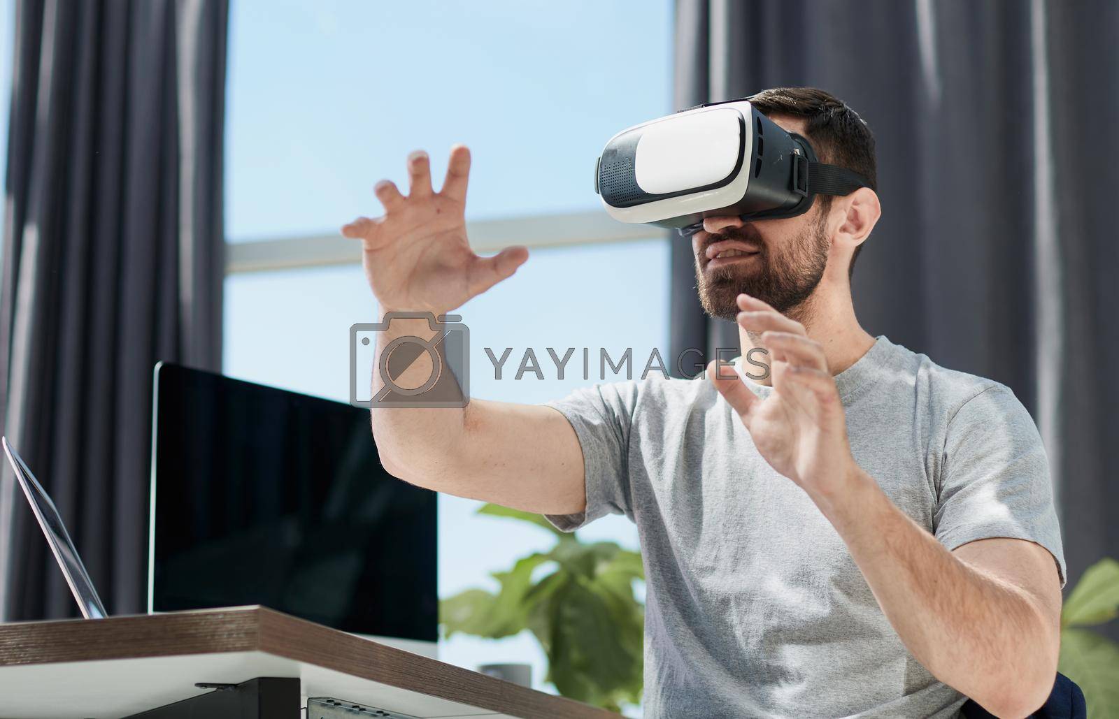 Royalty free image of businessman in 3d glasses with virtual hologram by asdf