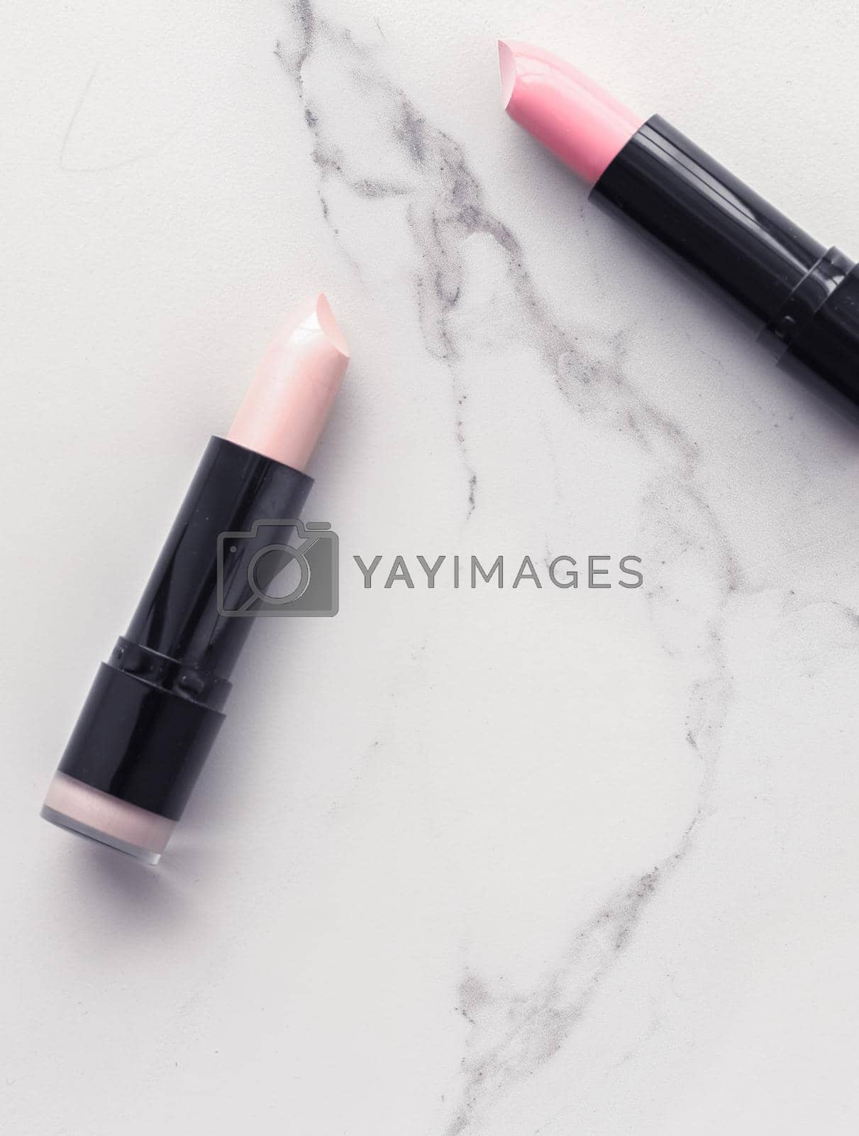 Royalty free image of Make-up and cosmetics flatlay on marble by Anneleven