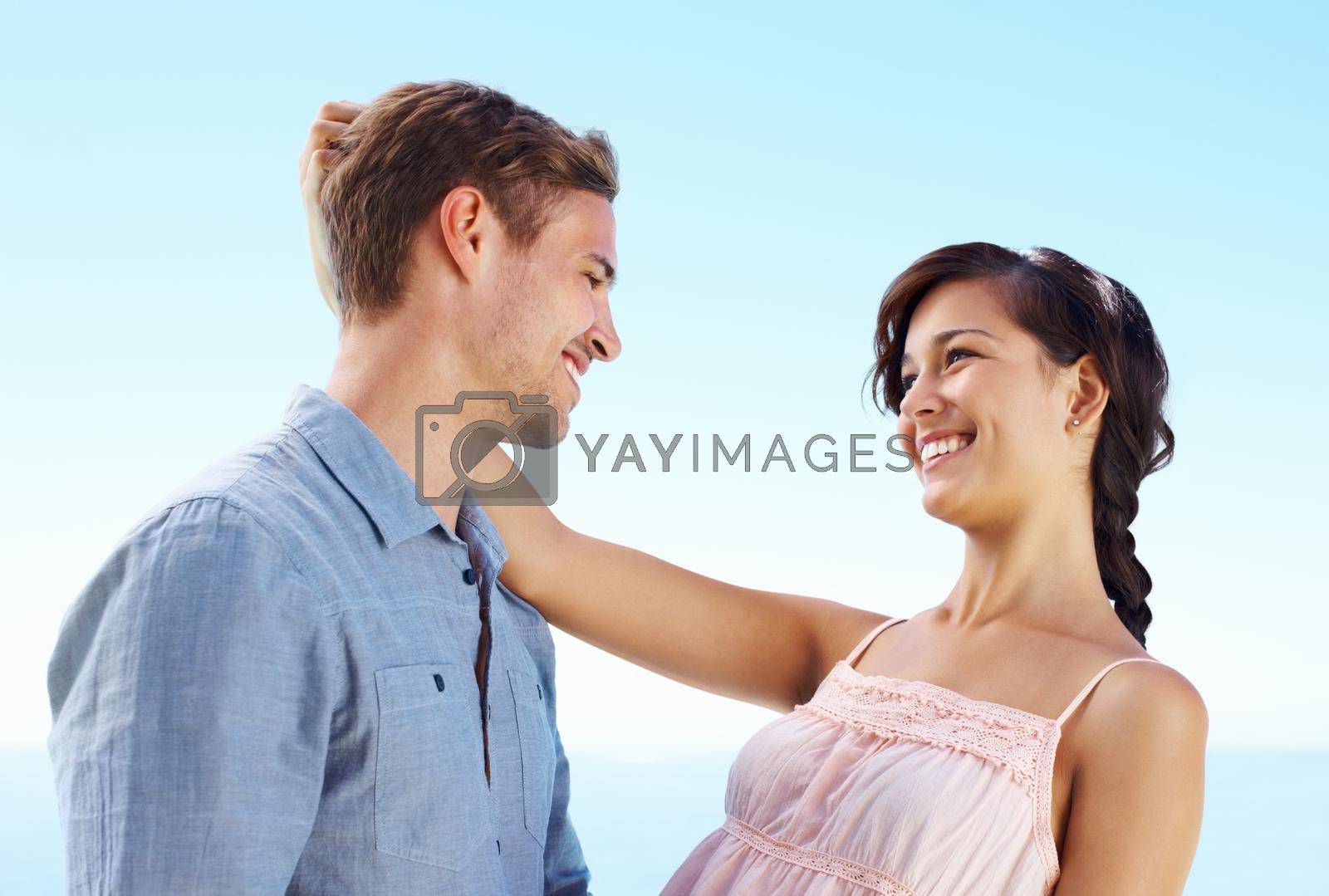 Royalty free image of Young couple enjoying outdoors. Portrait of young couple enjoying themselves outdoors. by YuriArcurs