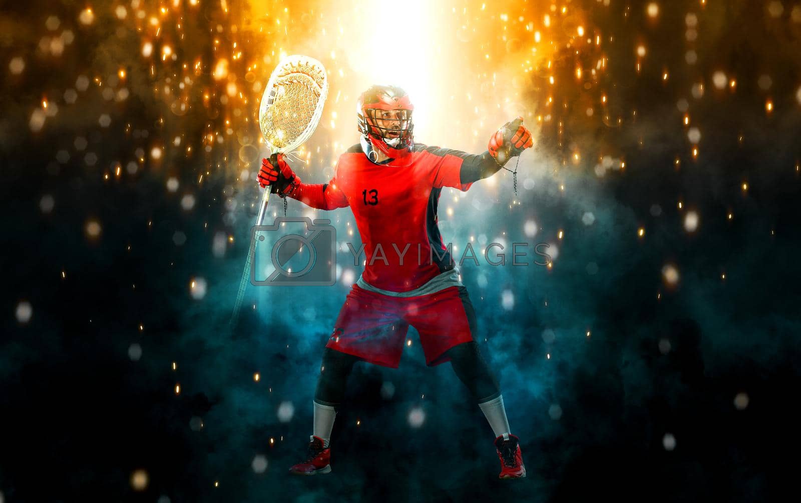 Royalty free image of Lacrosse Player, athlete sportsman in red helmet on dark background. Sport and motivation wallpaper. by MikeOrlov