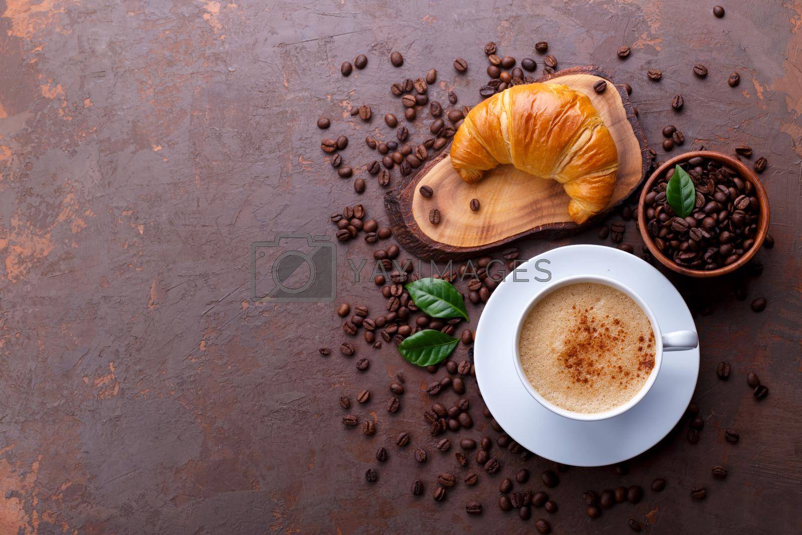 Royalty free image of Cup of black coffee and croissant by Lana_M