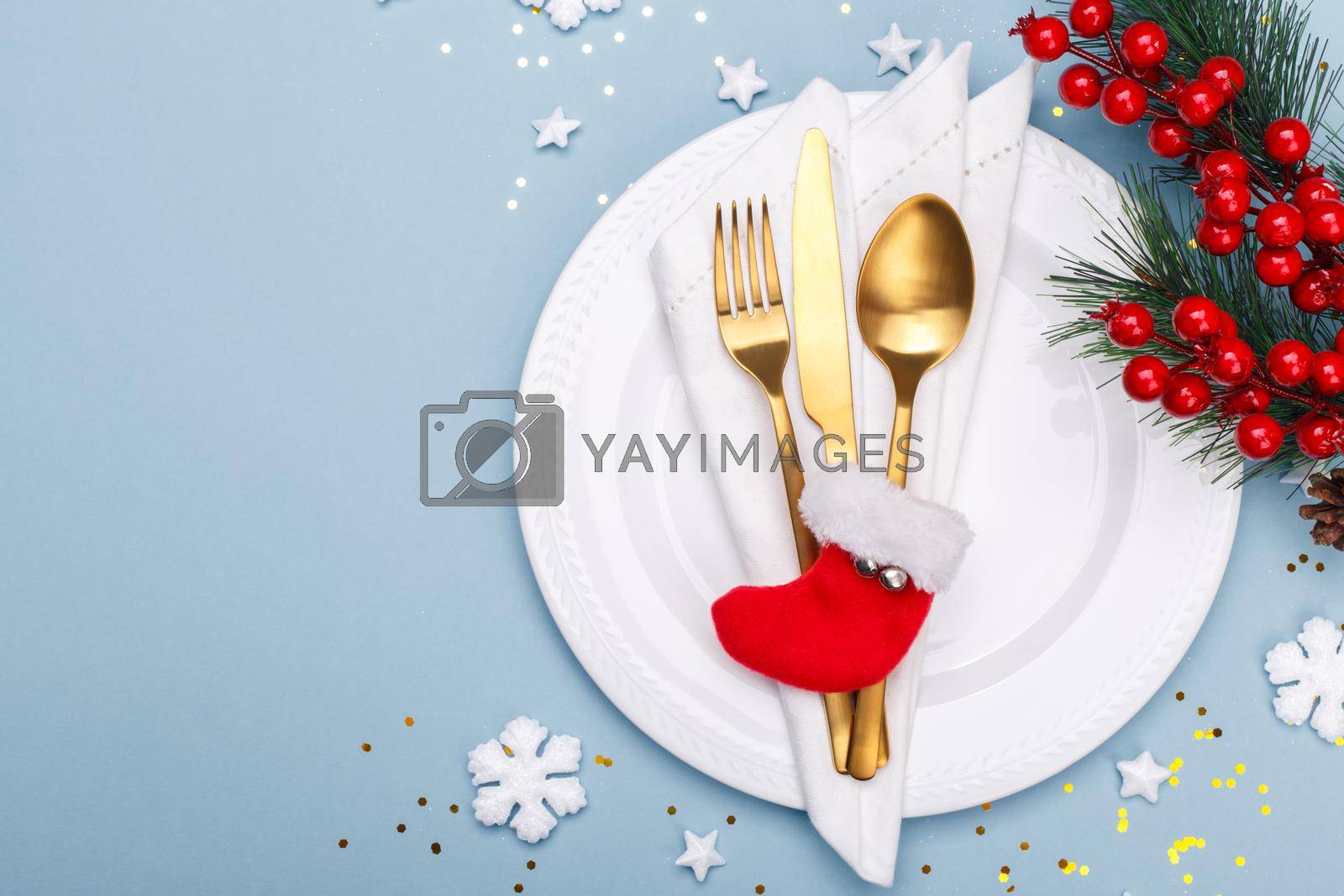 Royalty free image of Christmas or new year table setting with golden cutlery  by Lana_M