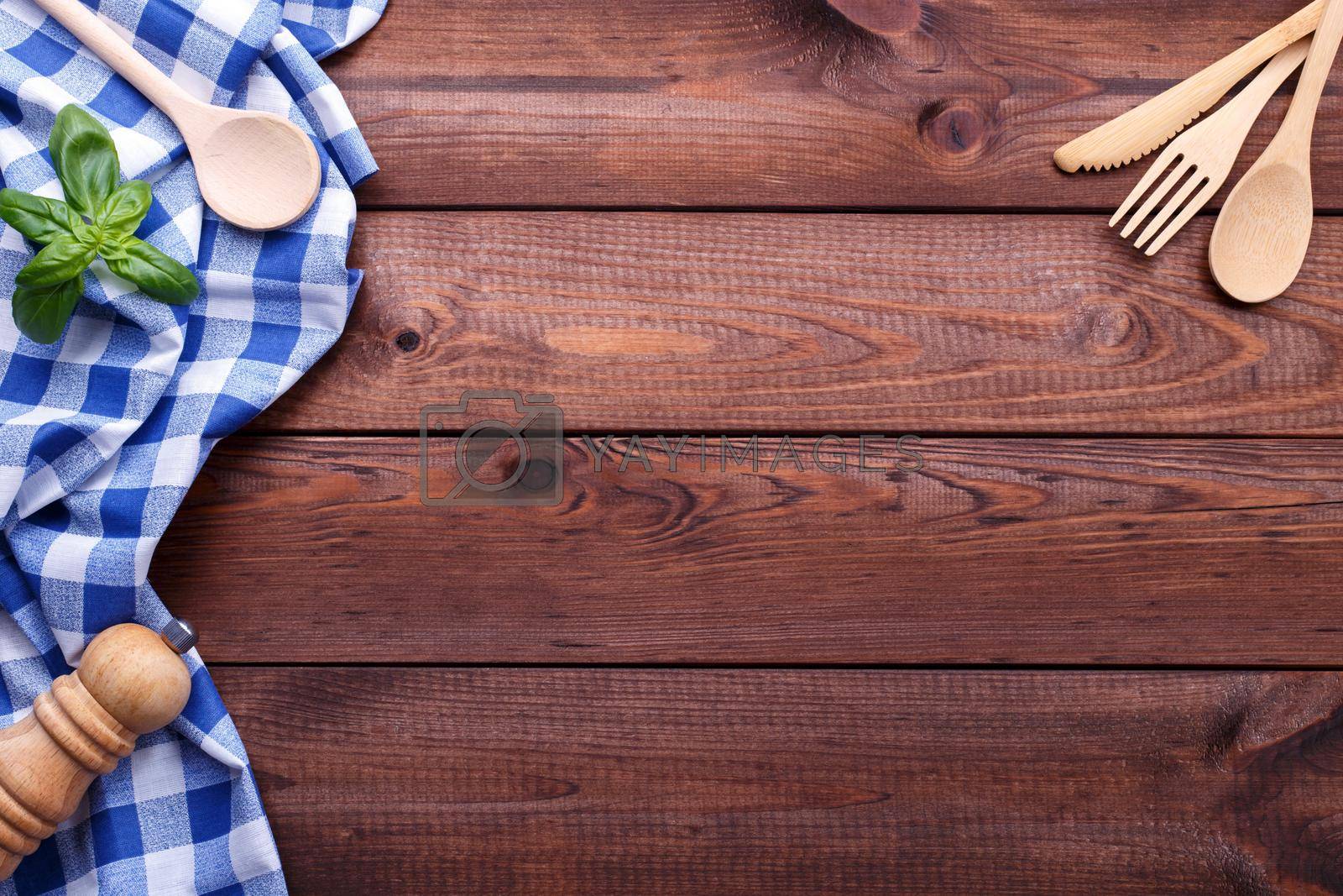 Royalty free image of Wooden background with cutlery by Lana_M