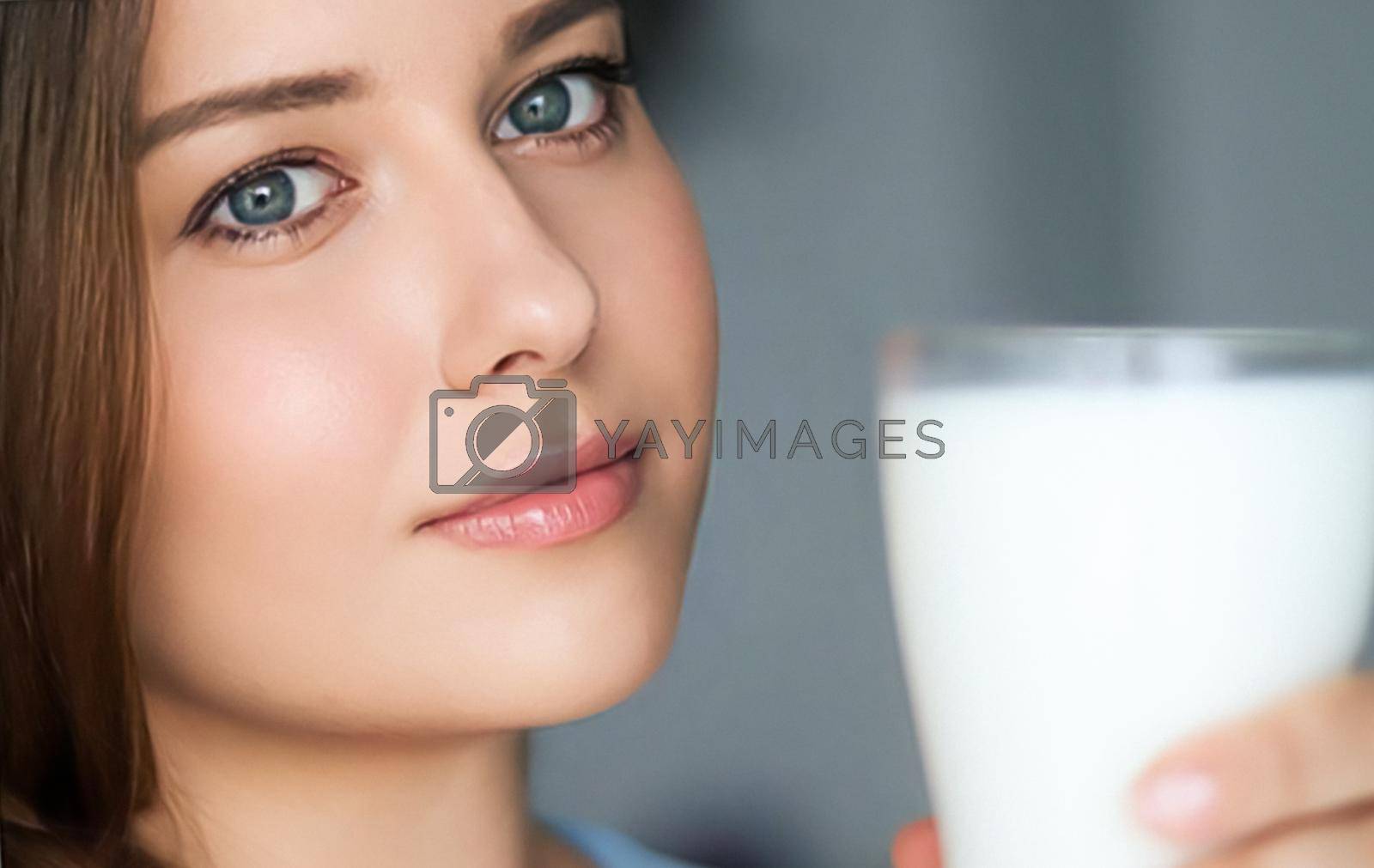 Royalty free image of Diet and wellness, young woman with glass of milk or protein shake cocktail by Anneleven