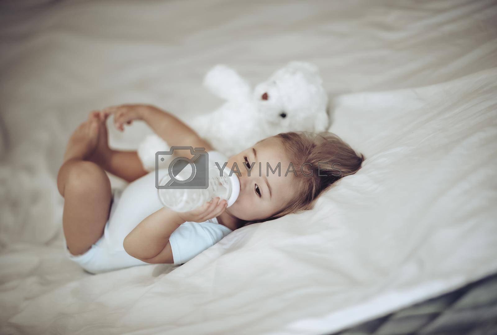 Royalty free image of Little Child Drinking Milk by Anna_Omelchenko