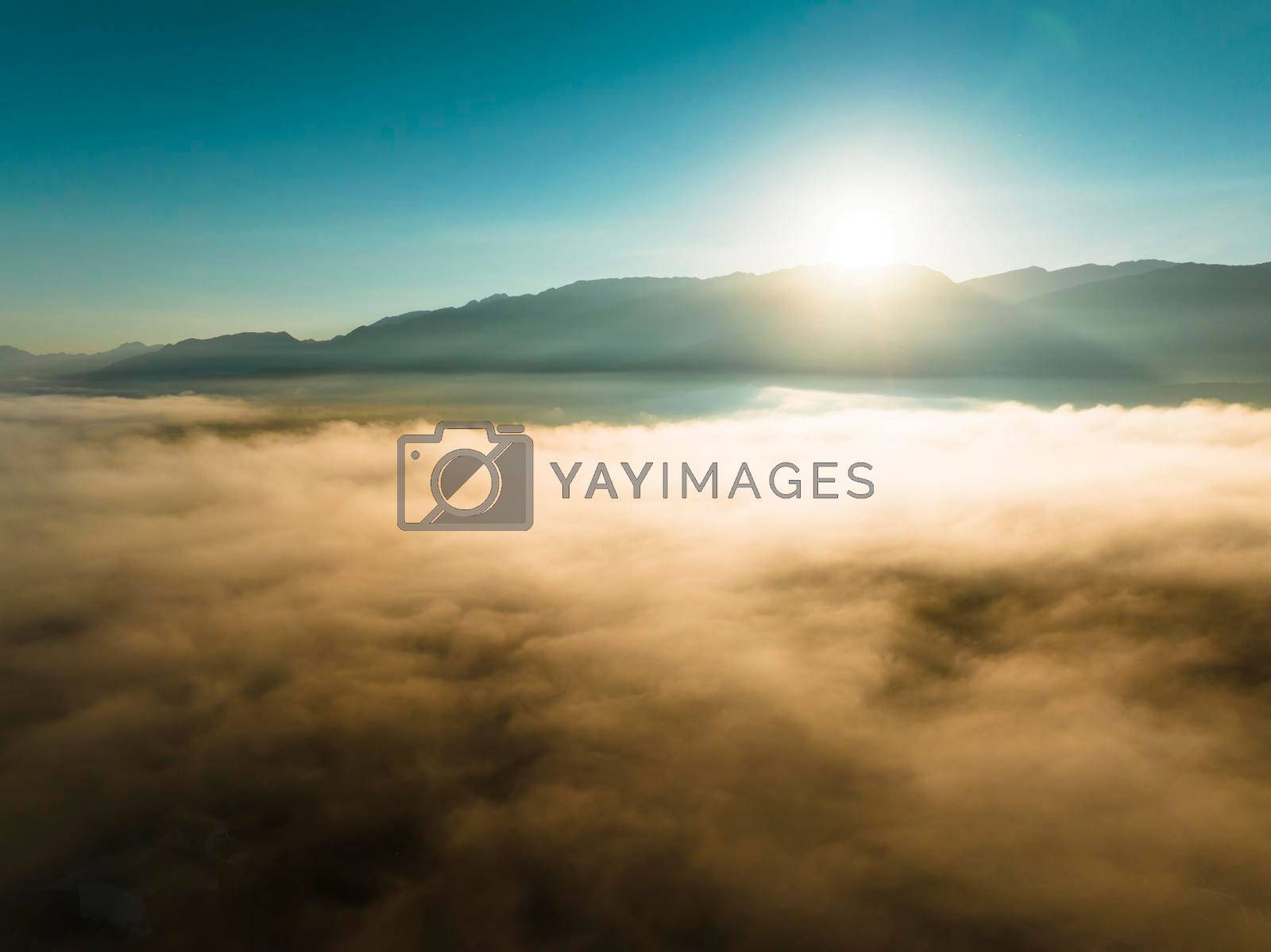 Royalty free image of Aerial view of mountains in orange clouds at sunrise in summer by tomwang