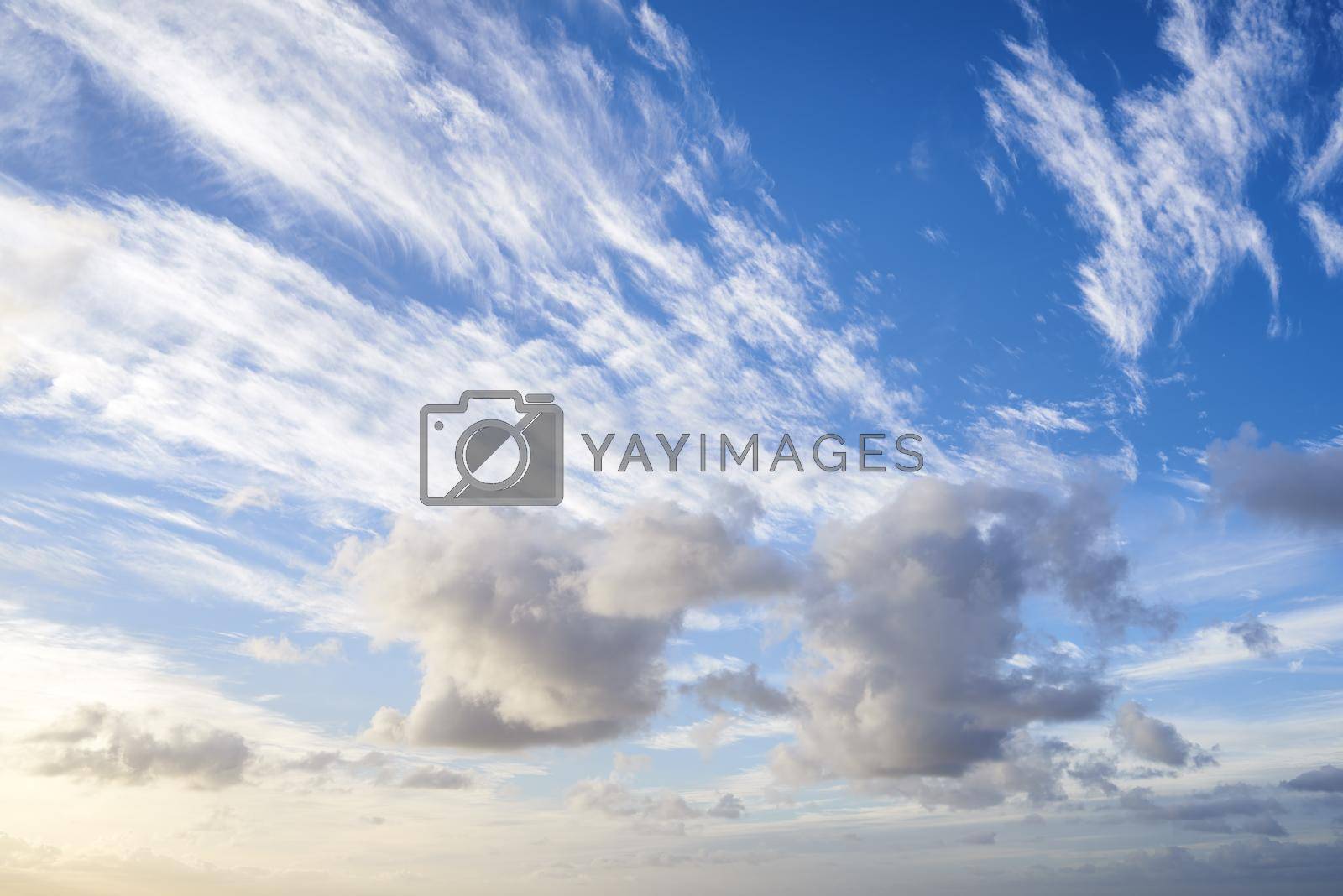 Royalty free image of Clouds, blue sky and sunset. A photo of beautiful clouds at sunset. by YuriArcurs