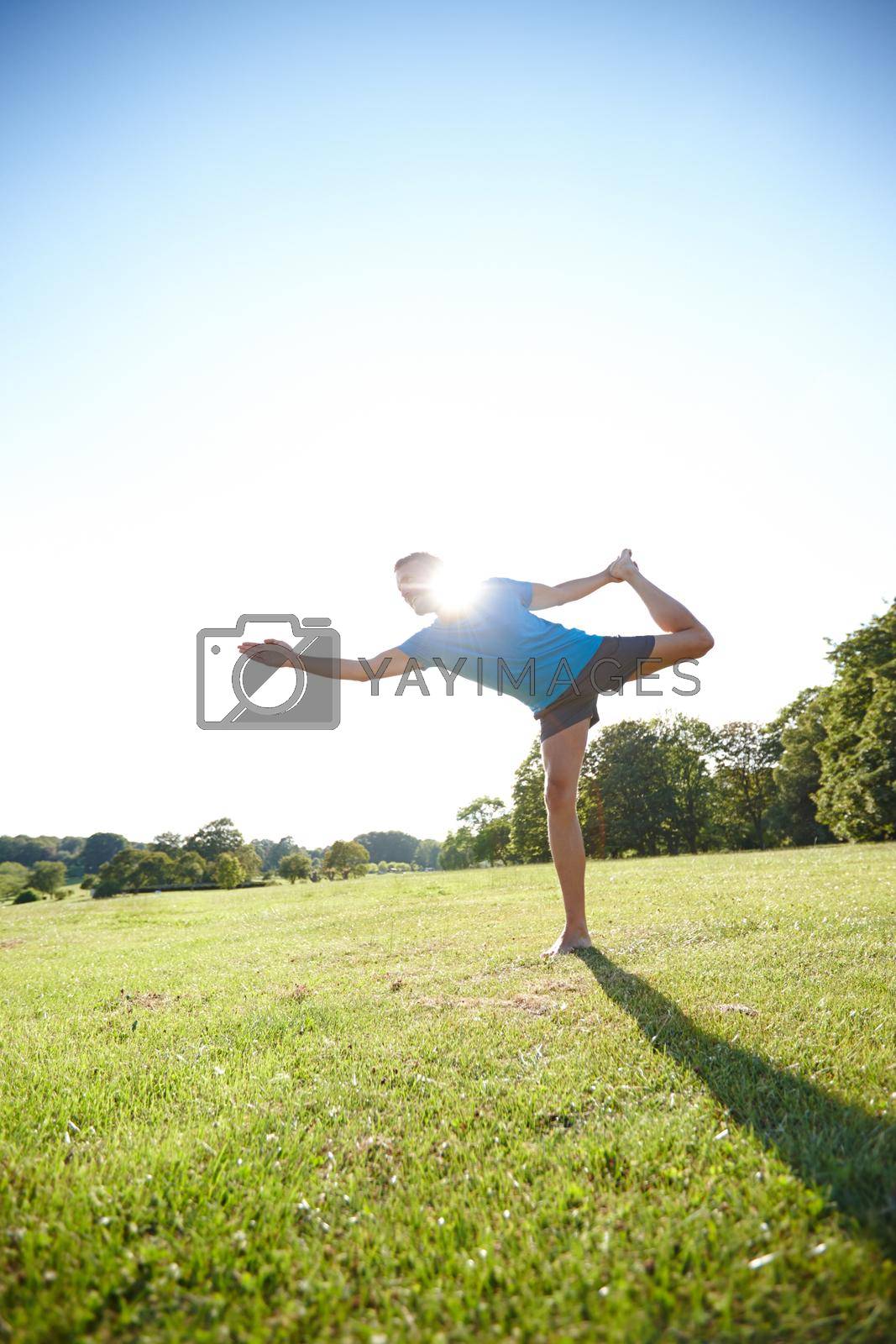 Yoga is the poetry of movement. Full length shot of a handsome mature man doing yoga outdoors