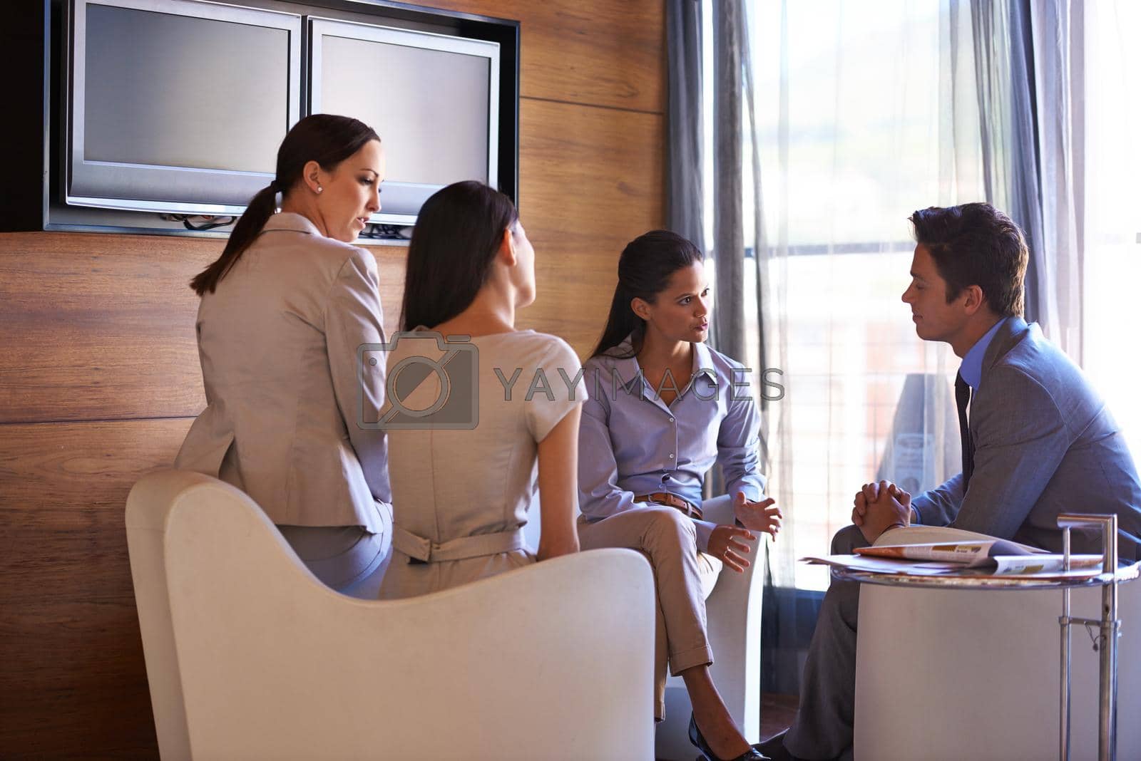 Royalty free image of Theres no substitute for hard work. a group of business colleagues having a meeting. by YuriArcurs