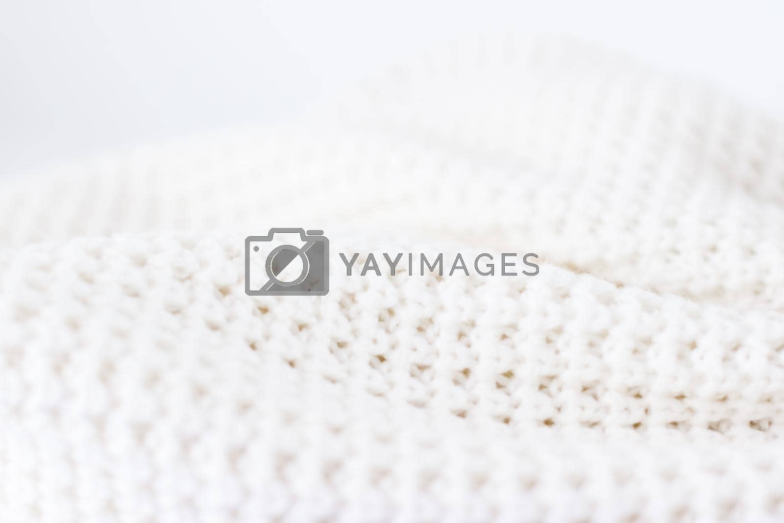 Royalty free image of Warm knitted clothes, soft and white by Anneleven