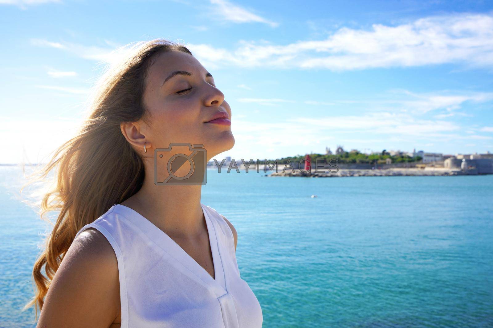 Royalty free image of Close-up woman relaxing breathing fresh air on sea by sergio_monti