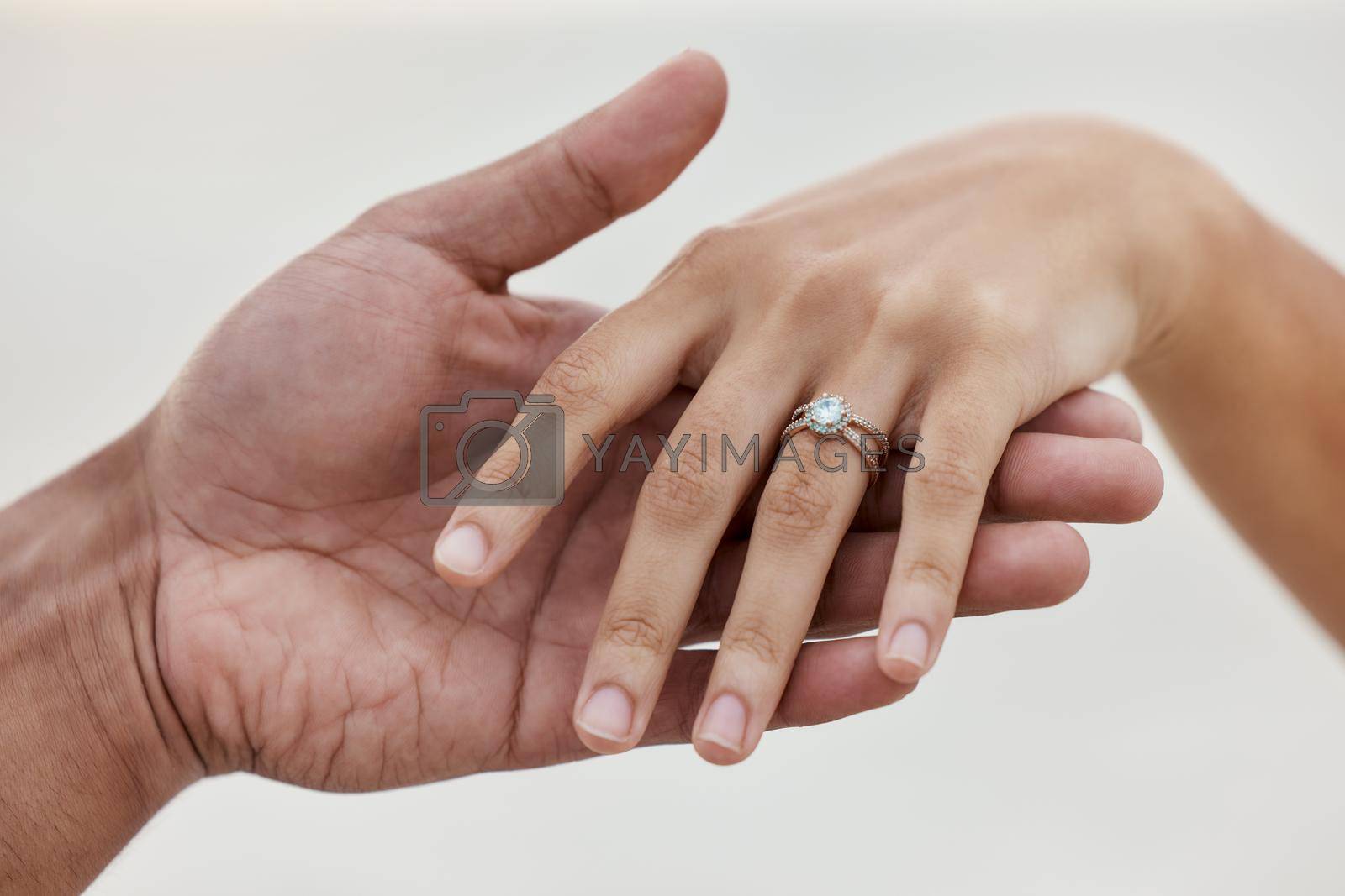 Marriage, jewellery and wedding ring with hands of couple for love, celebration and announcement together. Save the date, engagement and proposal with diamond jewelry on finger of bride.