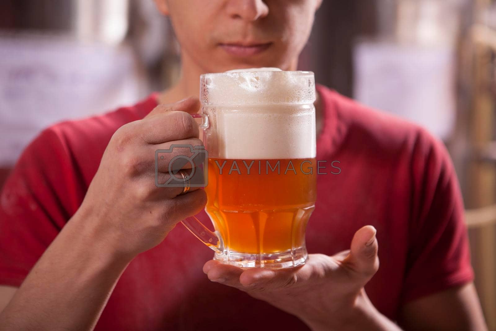 Royalty free image of Professional brewer making craft beer by MAD_Production