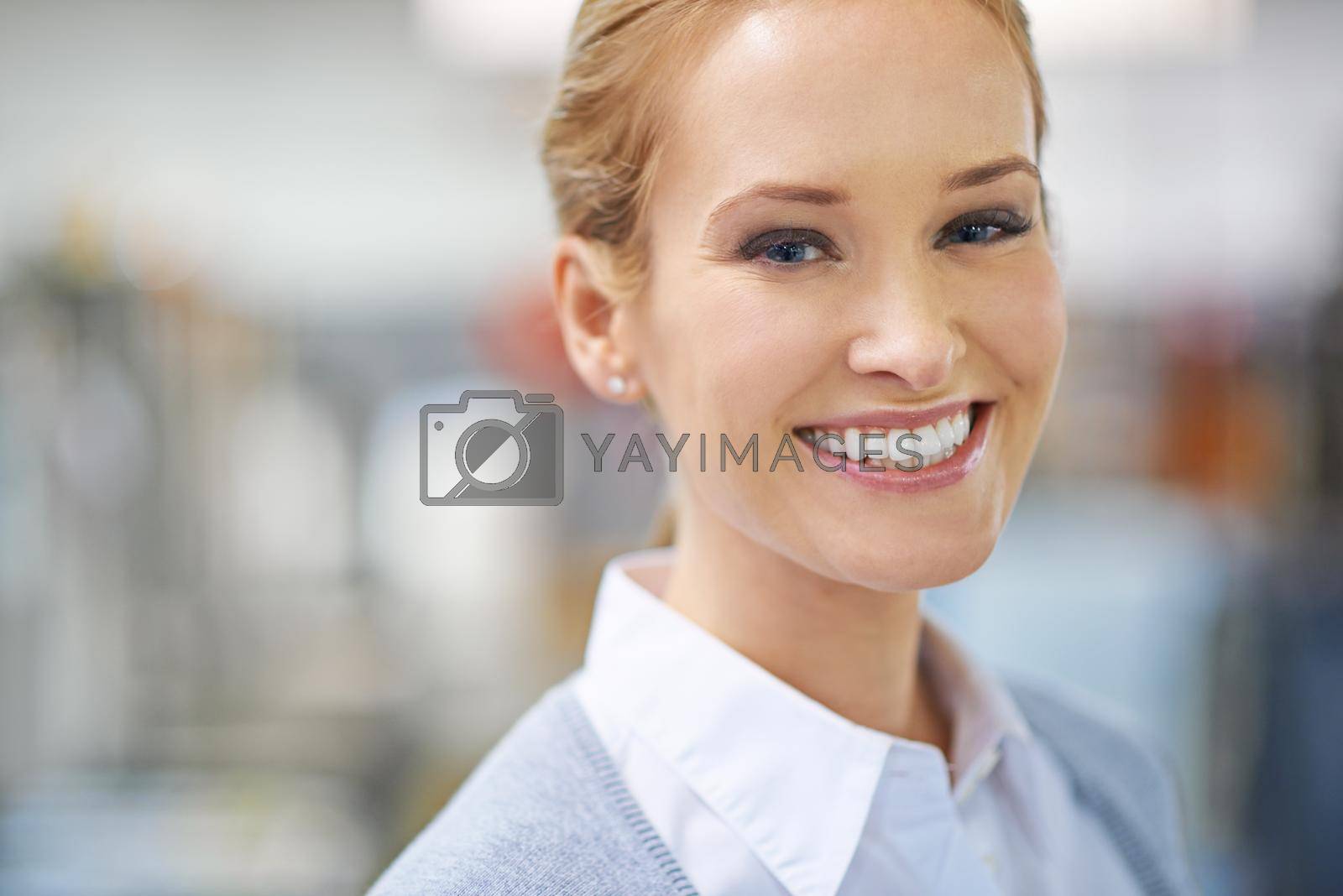 Royalty free image of All smiles on the factory floor. Portrait of a smiling young manager standing on the printing factory floor. by YuriArcurs