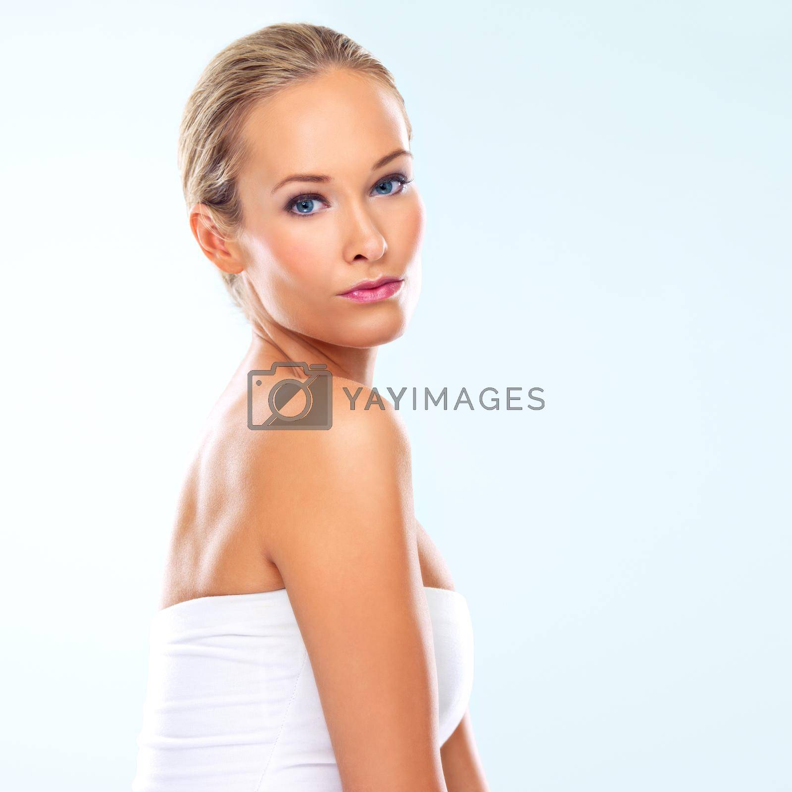 Royalty free image of Comfortable in her own skin. Studio portrait of an attractive blond woman. by YuriArcurs