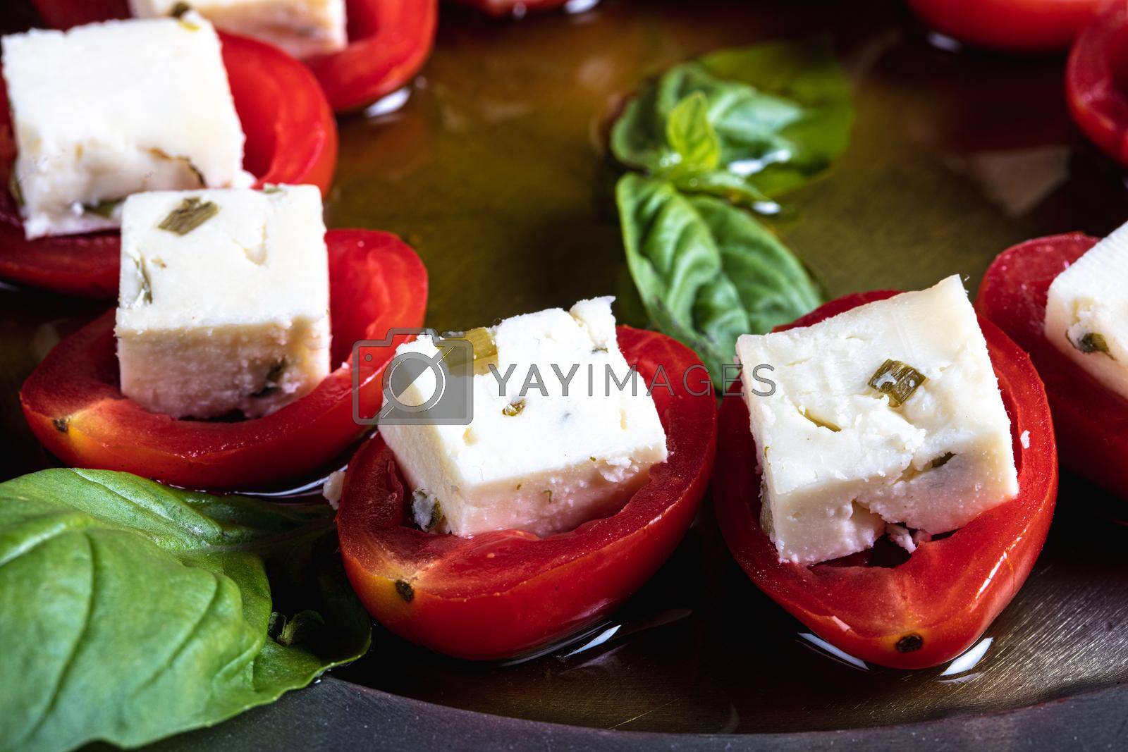 Royalty free image of Stuffed tomatoes with cheese and basil by senkaya