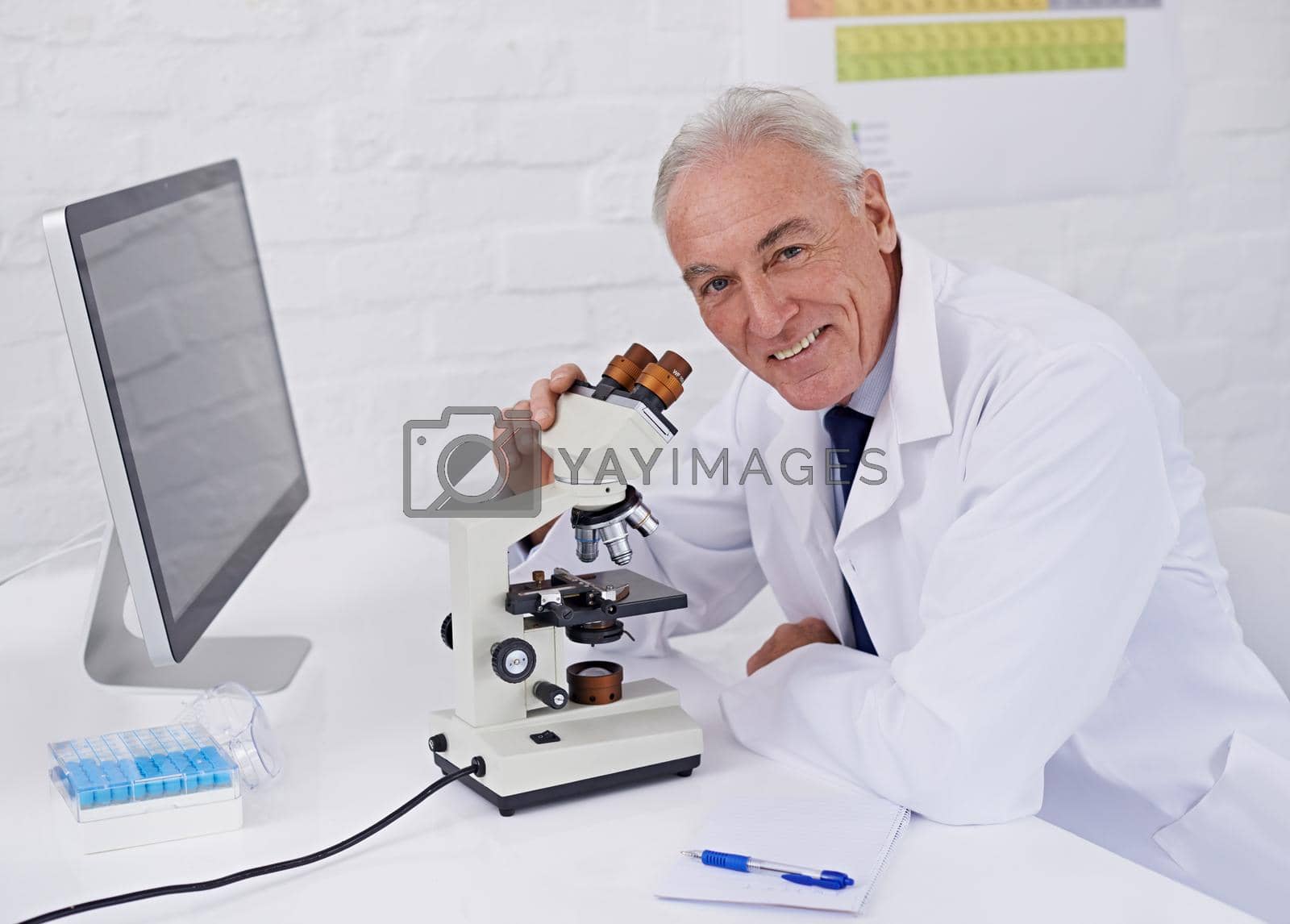 Royalty free image of I enjoy my job as a scientist. a mature scientist working in a lab. by YuriArcurs