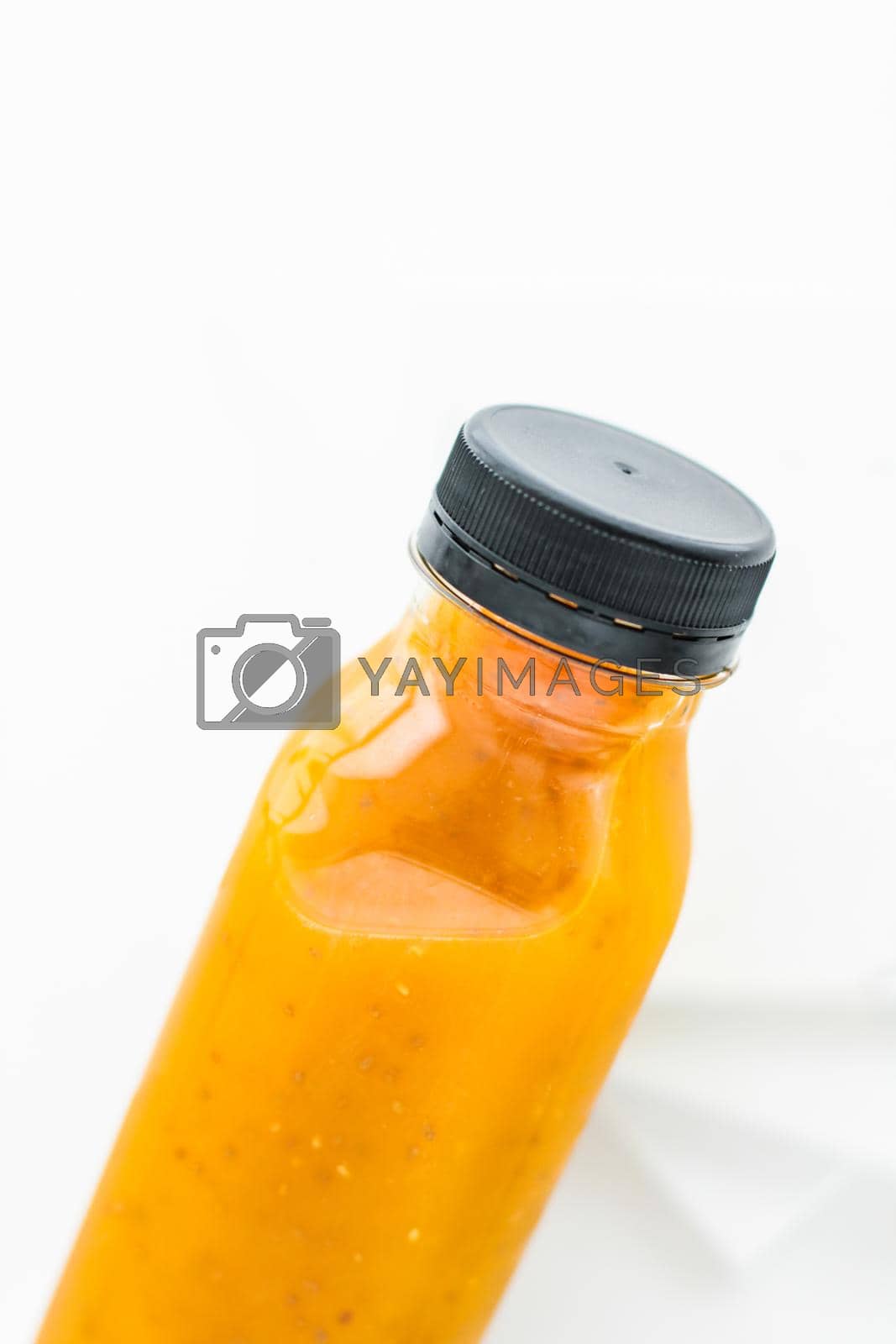 Royalty free image of Detox fruit smoothie juice in a bottle, diet catering delivery. Isolated on white background by Anneleven