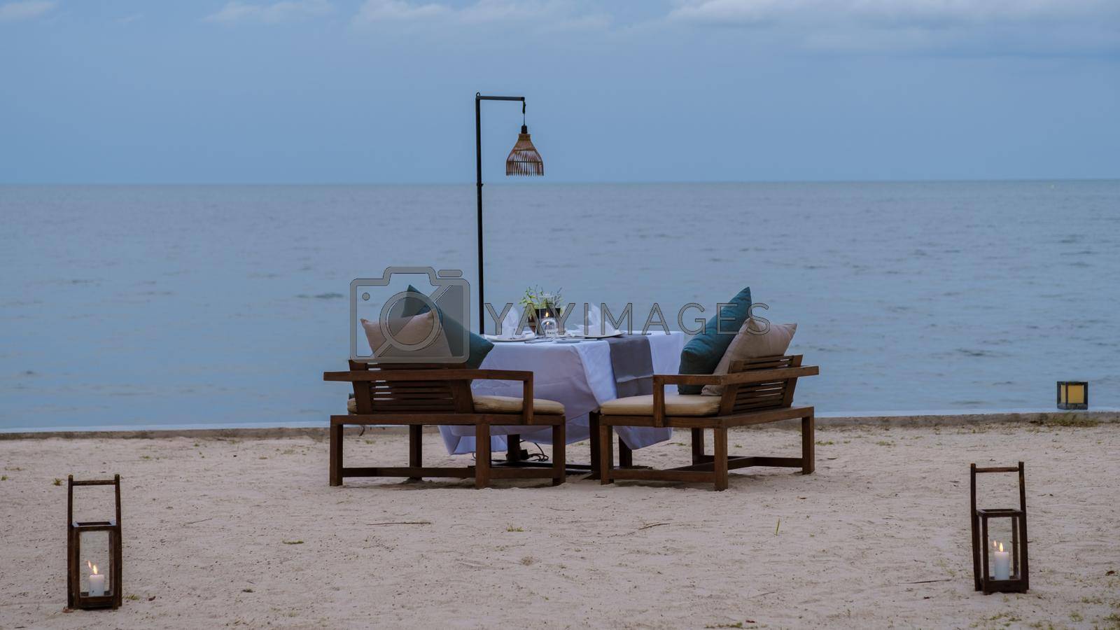 Royalty free image of Romantic dinner table by the ocean by fokkebok