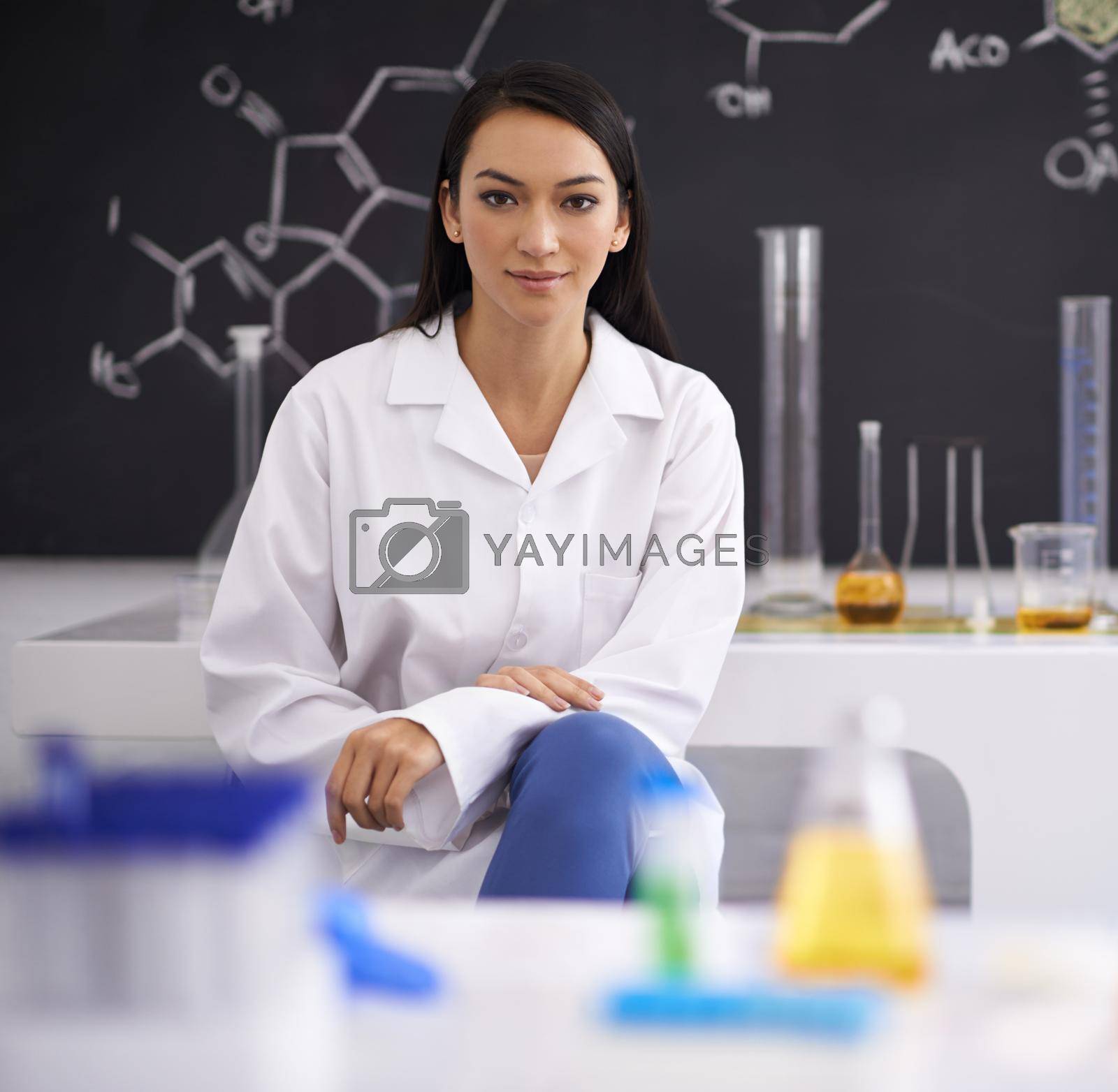 Royalty free image of Shes a true genius. Portrait of a female scientist sitting in a laboratory. by YuriArcurs