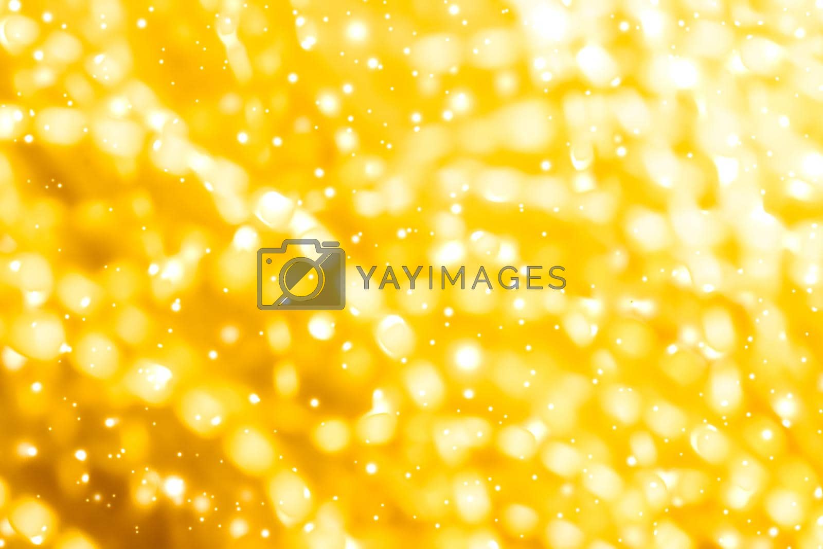 Royalty free image of Glamorous gold shiny glow and glitter, luxury holiday background by Anneleven