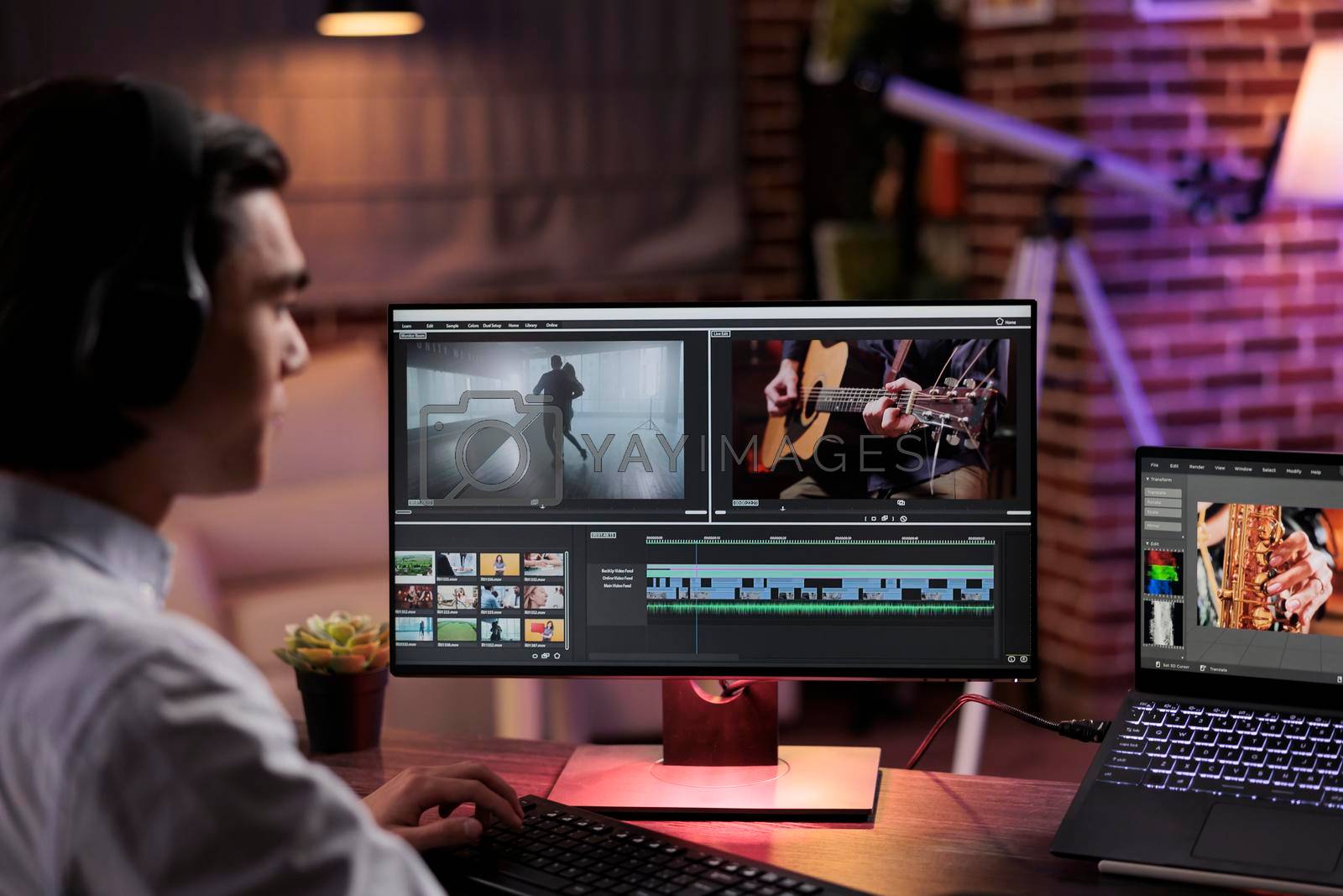 Royalty free image of Content creator editing video footage by DCStudio