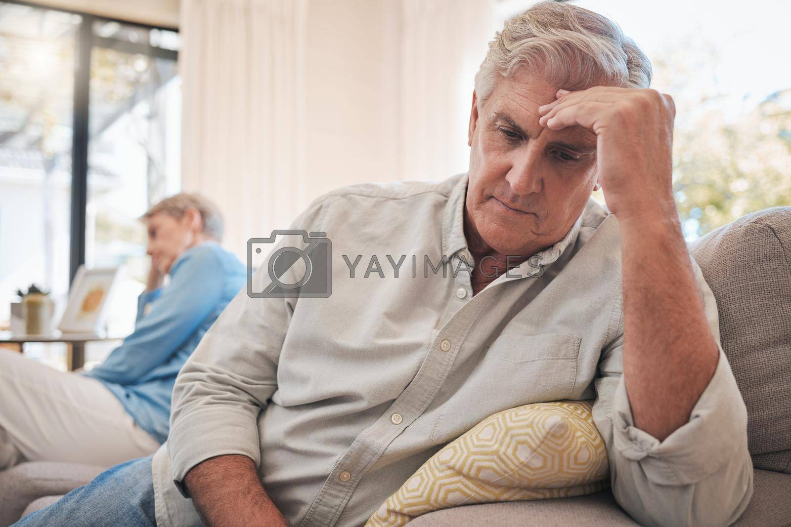 Royalty free image of Divorce, fight and problem with senior couple on sofa for conflict, cancer or depression together. Mental health, frustrated and angry with man and woman in retirement with fear, sad and marriage by YuriArcurs