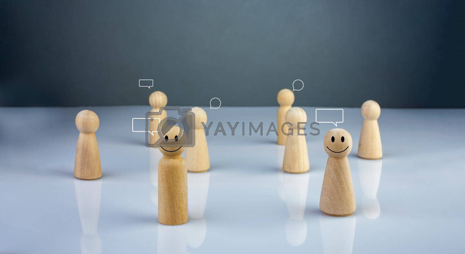 Royalty free image of Wooden doll figure with communication and technology symbols. Social media and technology concept. by Unimages2527