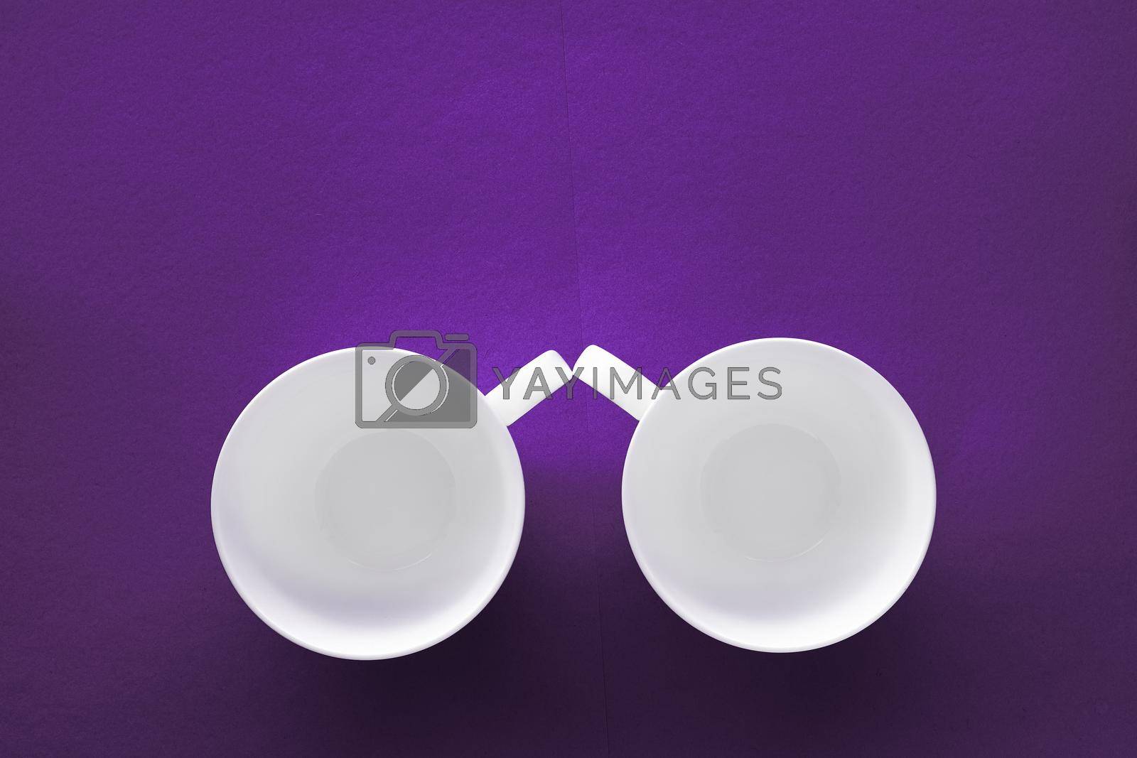 Royalty free image of White tableware crockery set, empty cup on purple flatlay background by Anneleven