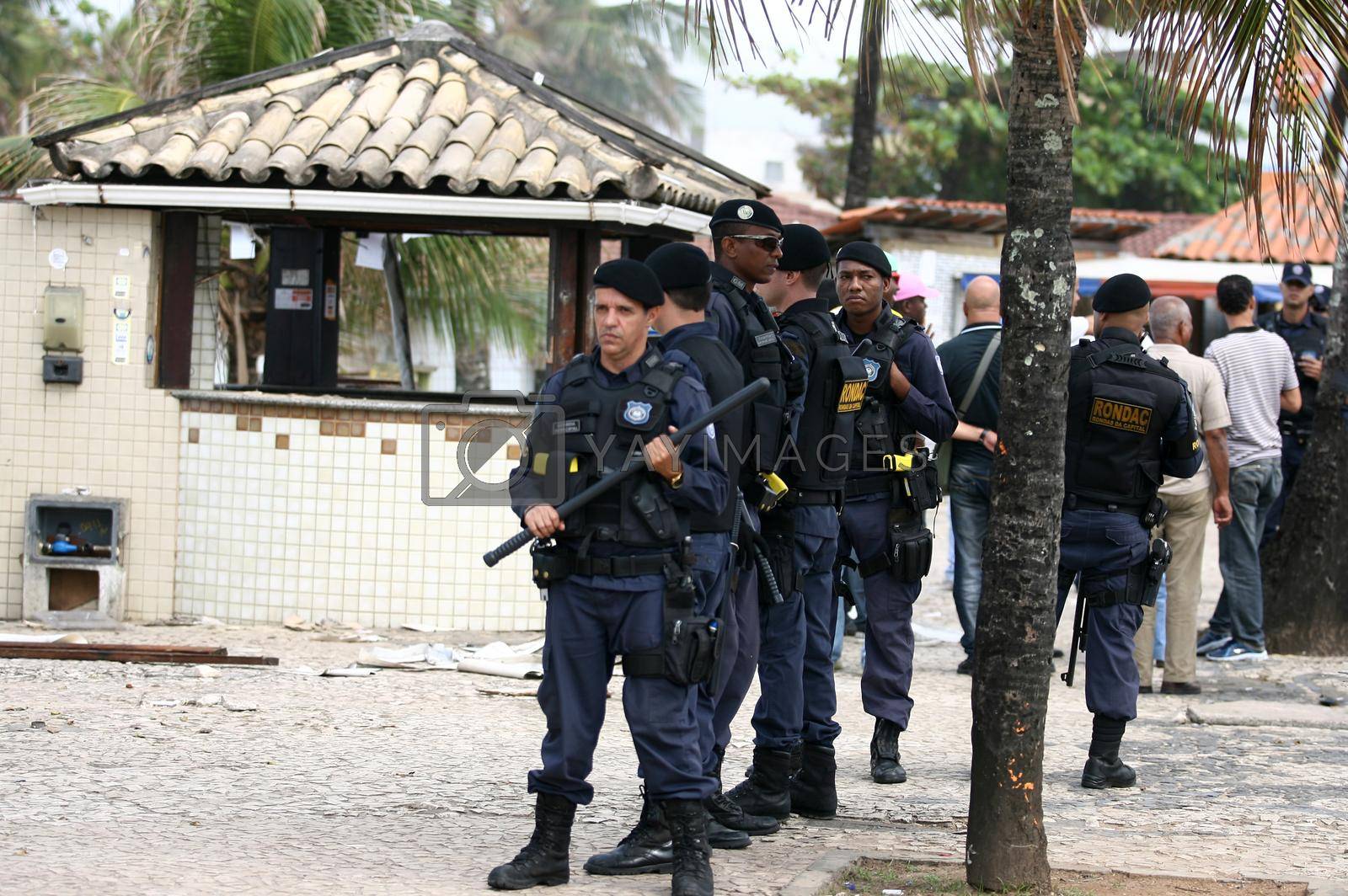salvador, bahia, brazil - july 15, 2014: agents of the Municipal Guard do security during road restoration works in the neighborhood of Itapua in the city of Salvador.
