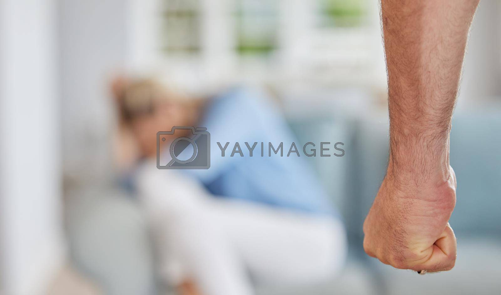 Royalty free image of Domestic violence in home, angry man fist threaten fear in scared woman and awareness of abuse pain. Physical conflict aggression, marriage problems with sad wife crying on floor and couple divorce by YuriArcurs