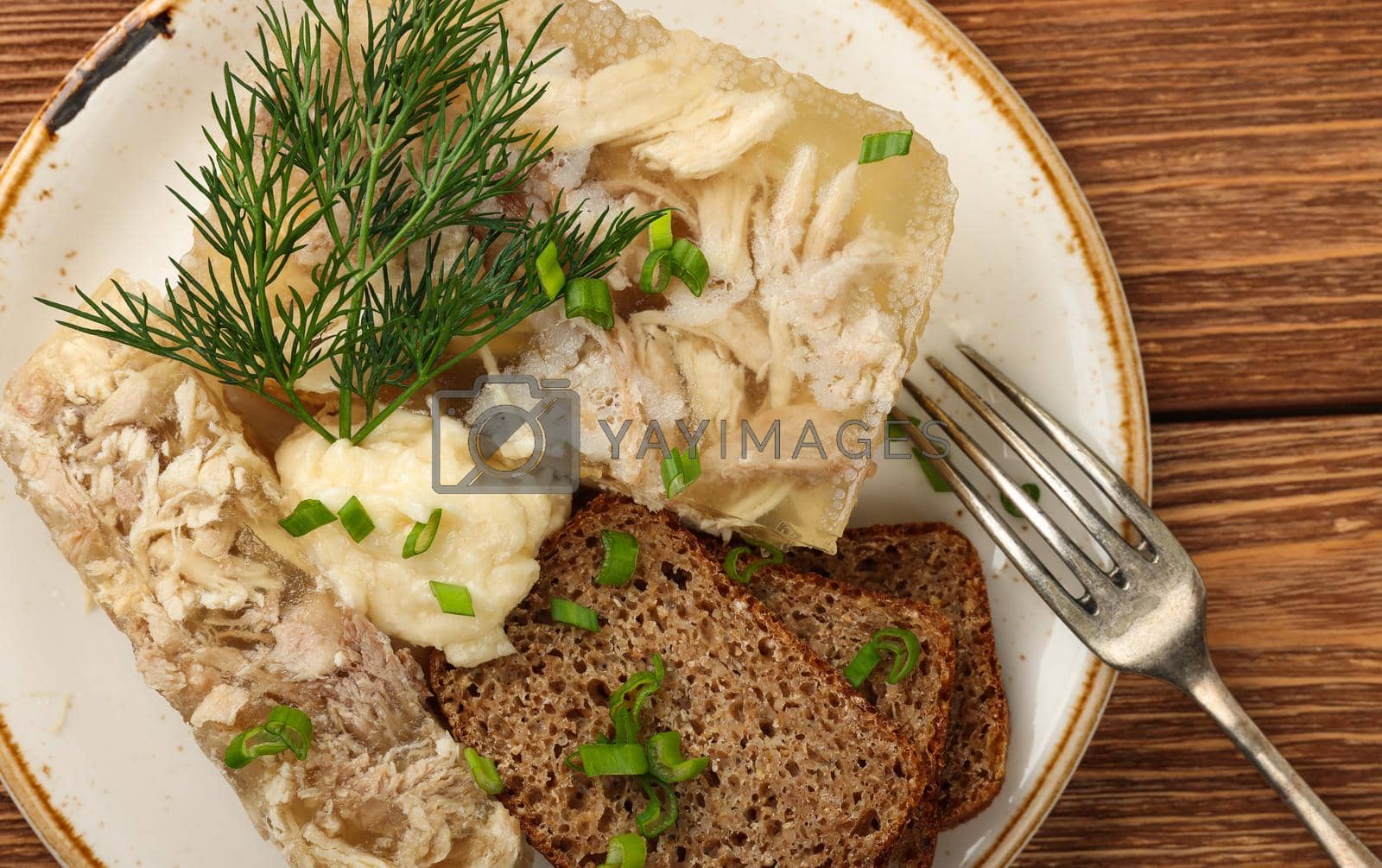 Royalty free image of Aspic or meat jelly portion with rye bread by BreakingTheWalls