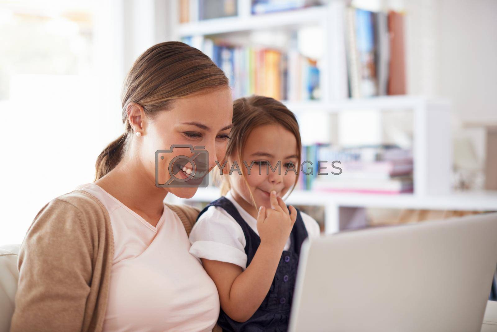 Showing her daughter how to browse safely. a mother using a laptop with her daughter
