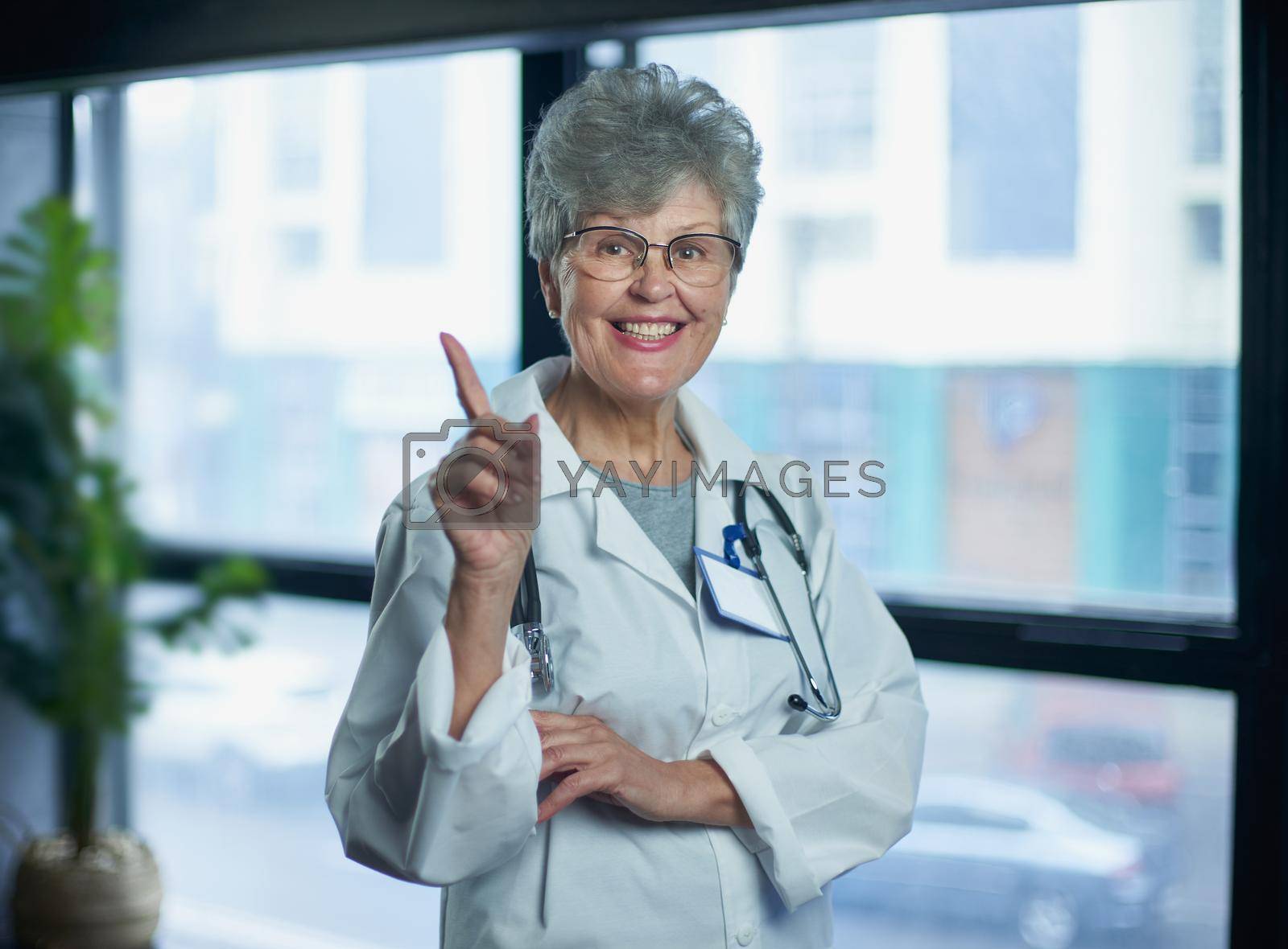 Royalty free image of Senior female doctor smiling in hospital by asdf