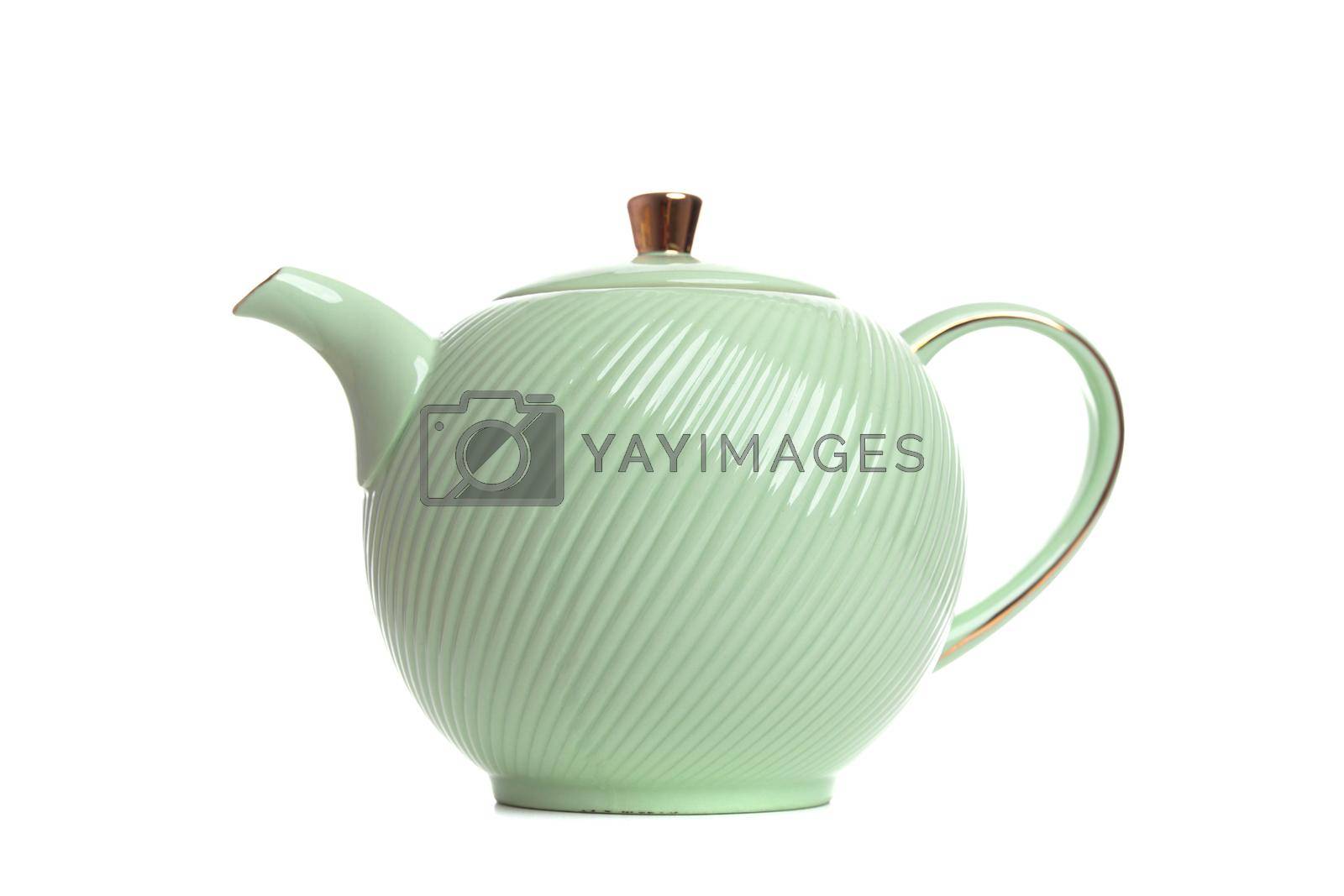 Royalty free image of light green porcelain teapot for making tea on a white background by TRMK