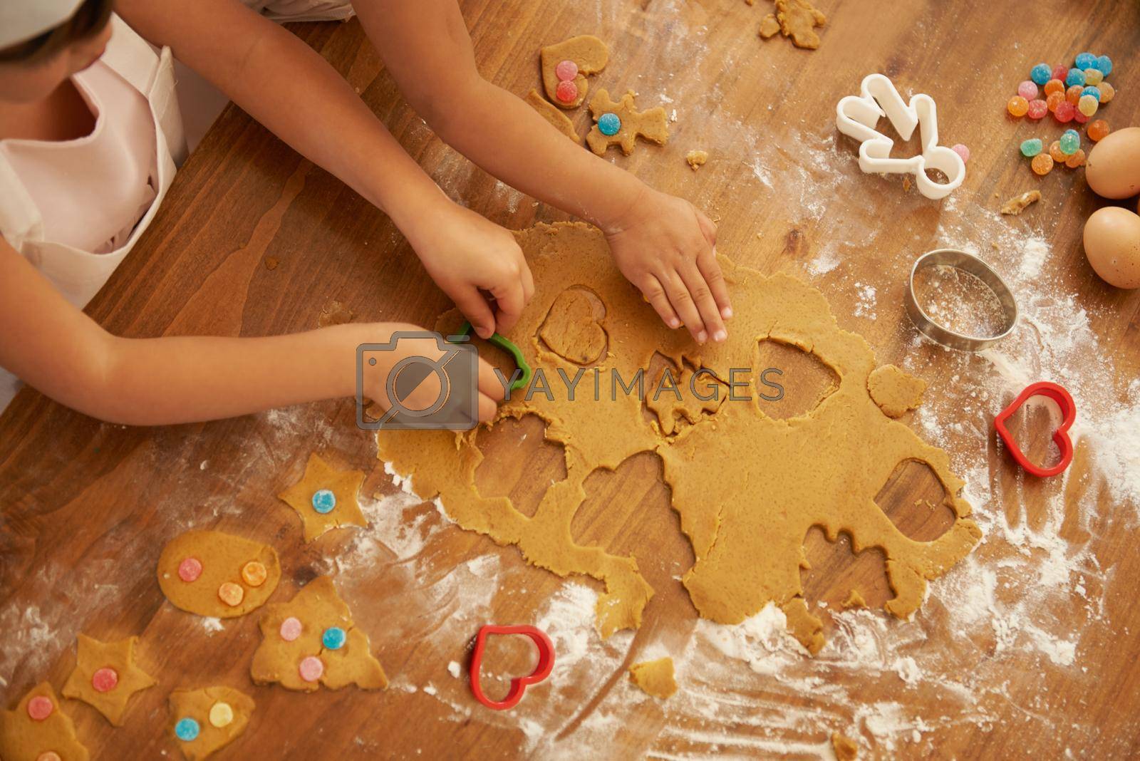 Royalty free image of Baking fun. High angle shot of two little girls baking in the kitchen. by YuriArcurs