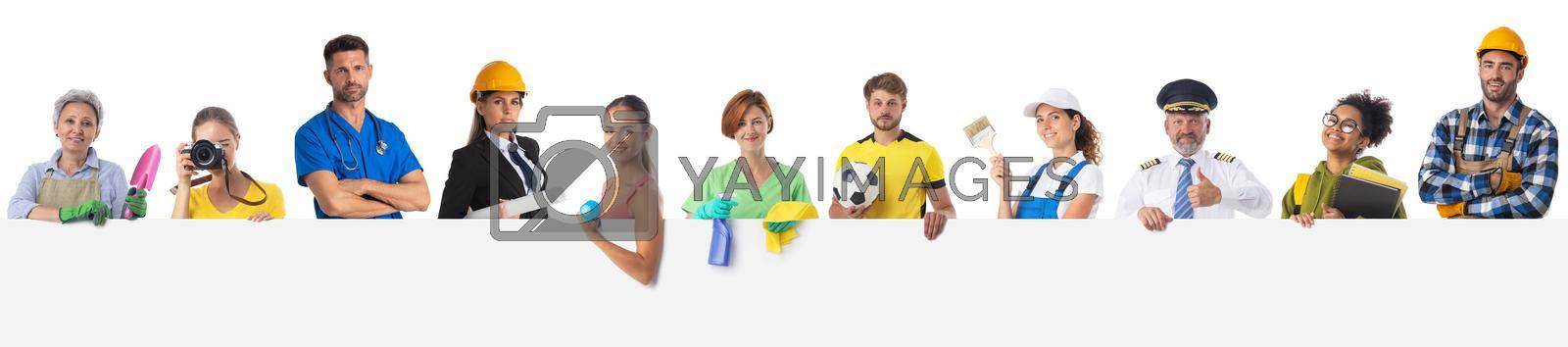 Royalty free image of Professional people with banner by ALotOfPeople