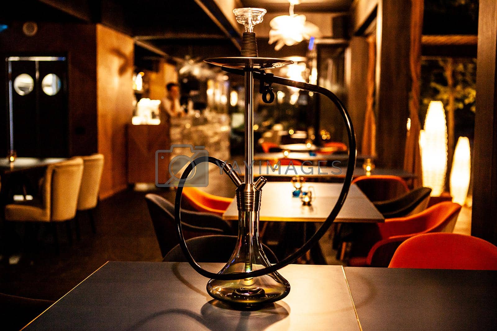Royalty free image of hookah in lounge bar on the table by DCStudio