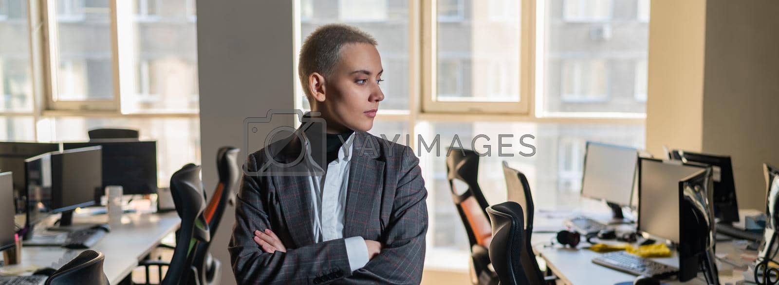 Royalty free image of Business woman with short haircut in empty office. by mrwed54