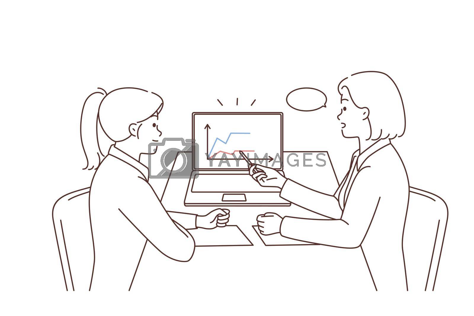 Royalty free image of Businesswomen discuss financial graphs in office by Vasilyeu