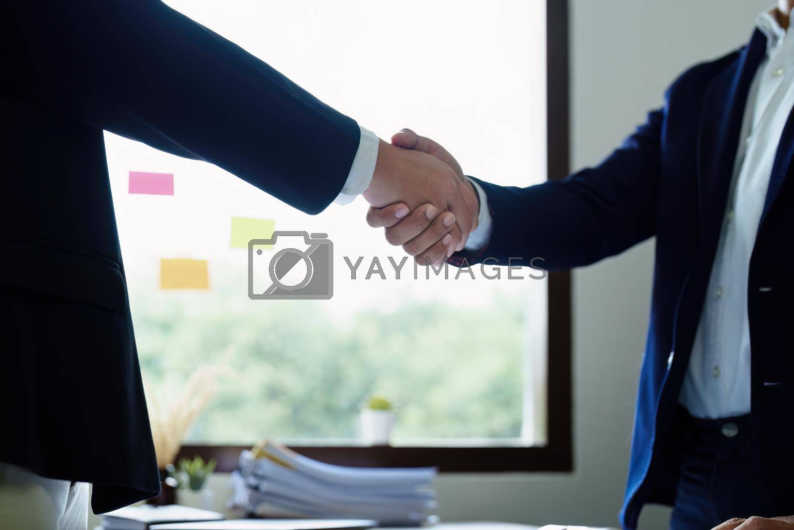 Royalty free image of Young businessman collaborate with partners to increase their business investment network for Plans to improve quality next month in their office. agreement concepts by Manastrong